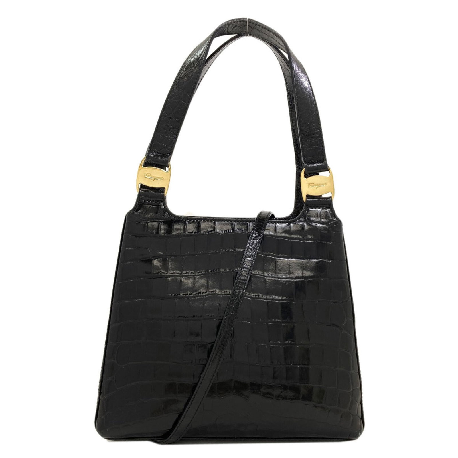Salvatore Ferragamo Handbag Leather: Salvatore Ferragamo Handbag Leather Black leather handbag from Salvatore Ferragamo, measuring 18cm x 22cm x 8.5cm, features a hook closure and adjustable strap length of 115cm. The bag's sleek design