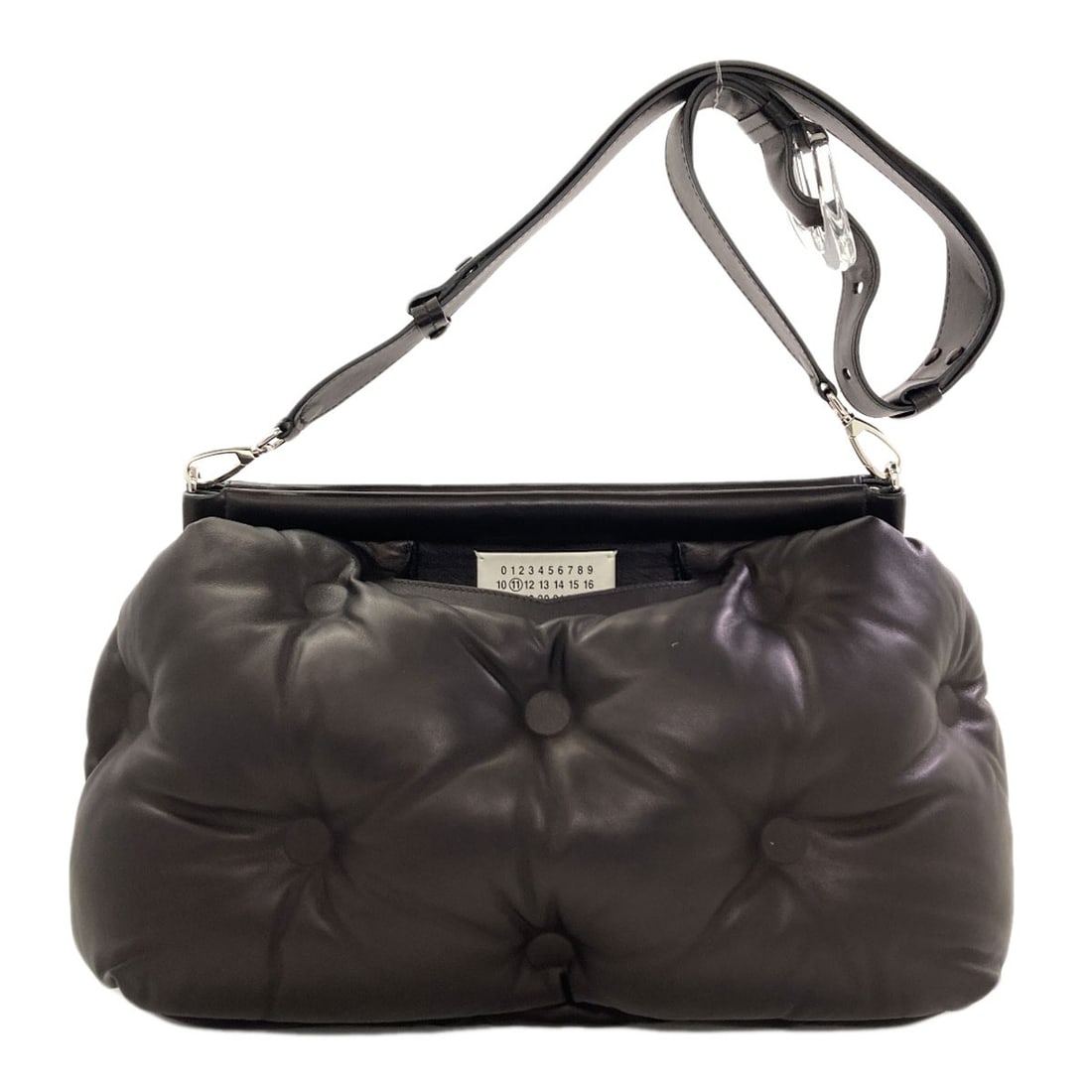 Maisonmargiela Gram Slam Shoulder Bag Calf: Maisonmargiela Gram Slam Shoulder Bag Calf The Maison Margiela Gram Slam Shoulder Bag is a sleek and versatile design, featuring a magnetic closure and a sturdy calf exterior. Measuring 9.8 inches in