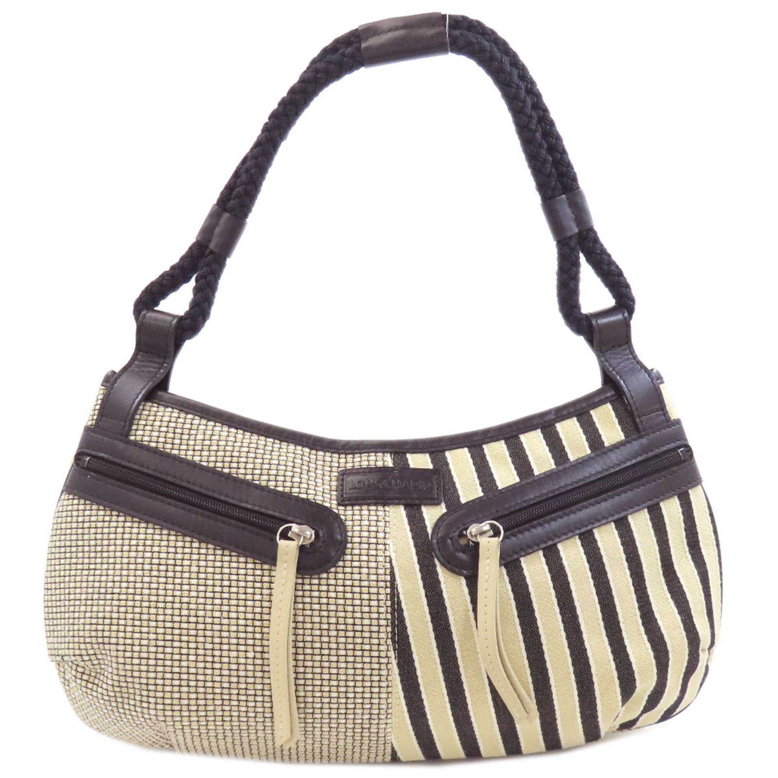 Canvas handbag Longchamp: Canvas handbag Longchamp Canvas handbag in beige and black, measuring 18cm x 34cm x 9cm, made from canvas material. The bag features a classic design with a signature on the canvas. Item Specifics: