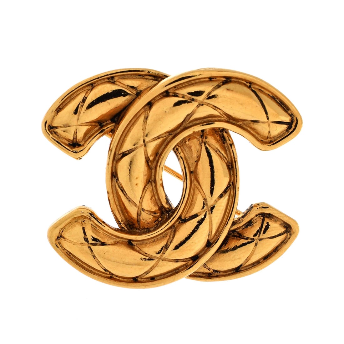 Chanel Vintage Quilted CC Brooch Metal: Chanel Vintage Quilted CC Brooch Metal The Chanel Vintage Quilted CC Brooch Metal boasts a striking gold finish, with a quilted design that adds visual interest. Measuring 1.3" in height and 1.6" in