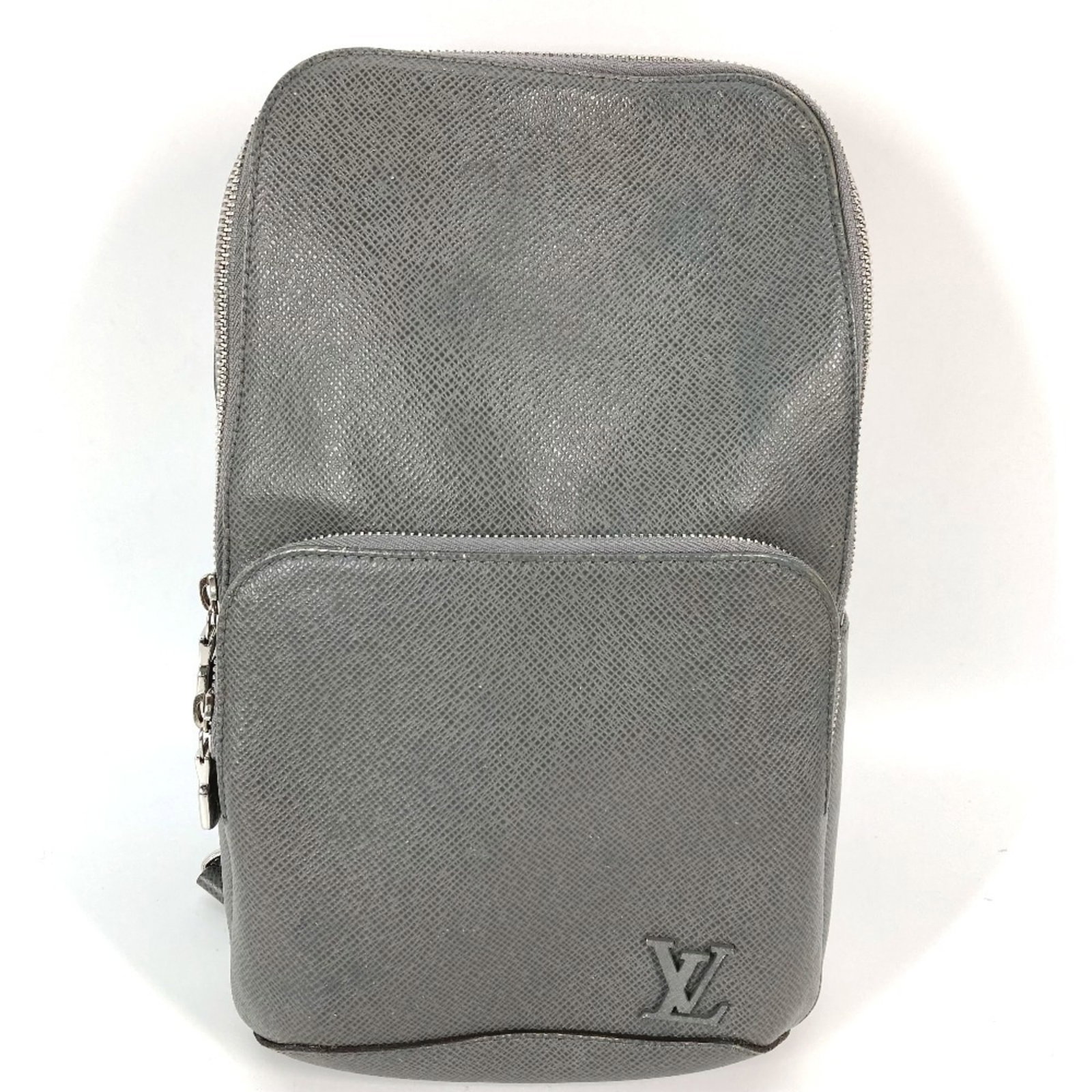 Sling Bag Leather Taiga Bag Louis Vuitton: Sling Bag Leather Taiga Bag Louis Vuitton Taiga leather gives this Louis Vuitton sling bag a rugged, sophisticated look. With its open zipper pocket and simple, understated design, this bag is a