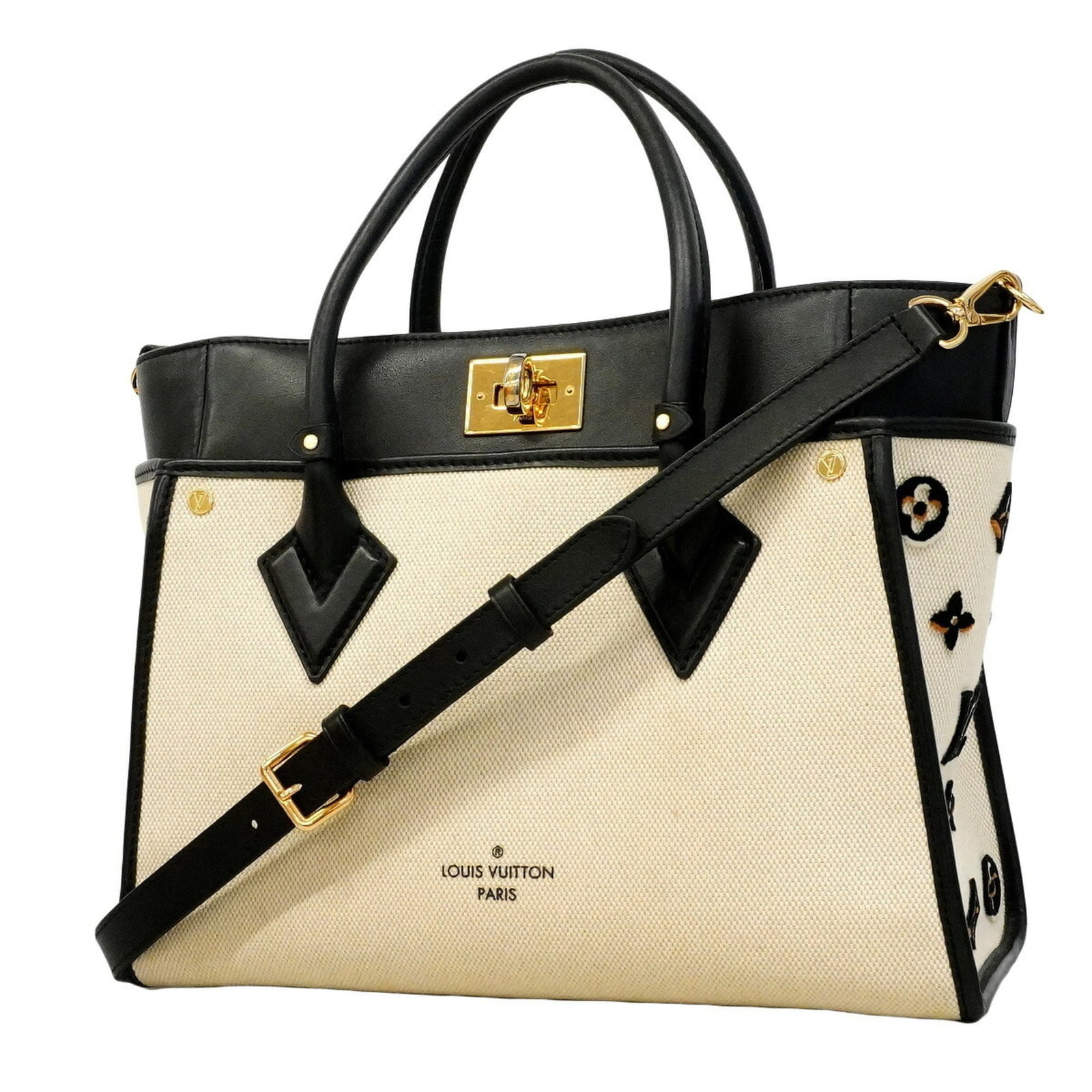 Handbag Louis Vuitton: Handbag Louis Vuitton Black and off-white Louis Vuitton handbag with dimensions 25cm x 31cm x 13cm. This stylish bag features a classic design with a signature monogram pattern. Made with a durable