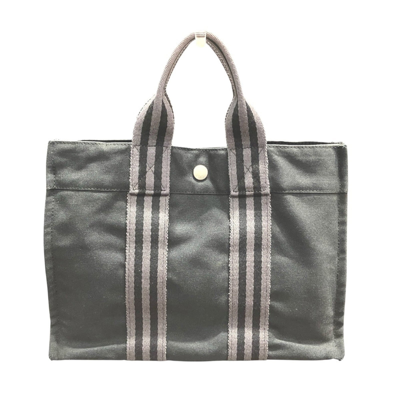Canvas tote bag Hermes: Canvas tote bag Hermes Canvas tote bag from the iconic Hermes Fourre Tout line, featuring a classic black and gray color combination. Made from high-quality canvas, this timeless tote boasts a sleek