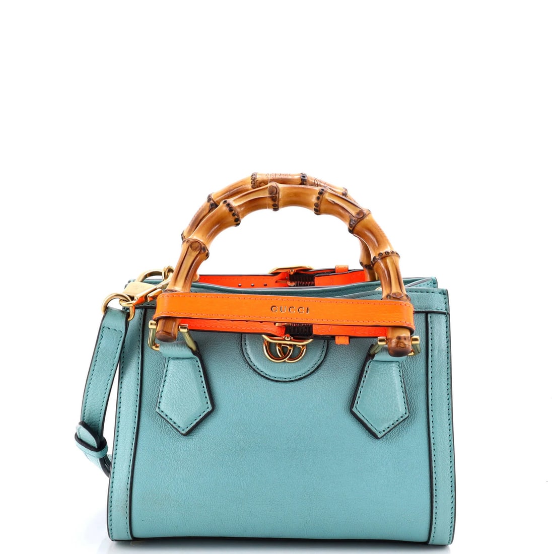 Gucci Leather Mini Bamboo Handle Tote Diana NM: Gucci Leather Mini Bamboo Handle Tote Diana NM Gucci's iconic Leather Mini Bamboo Handle Tote, the Diana NM, is a stylish and functional accessory. This cross-body bag boasts a sleek blue exterior, a