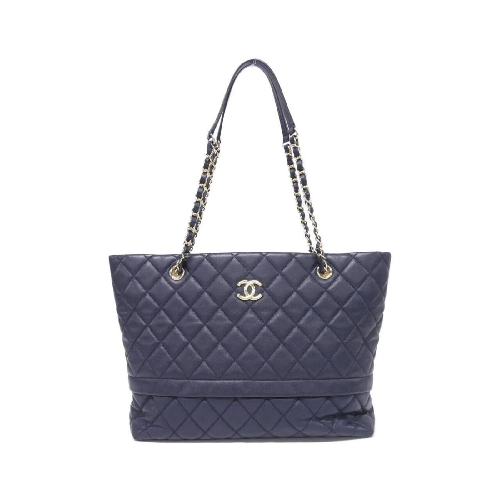 Calfskin Grained Chanel Bag Shoulder: Calfskin Grained Chanel Bag Shoulder Calfskin Grained Chanel Bag Shoulder is made from high-quality Grained Calfskin and features a classic shoulder design. The bag's navy color and gold hardware add