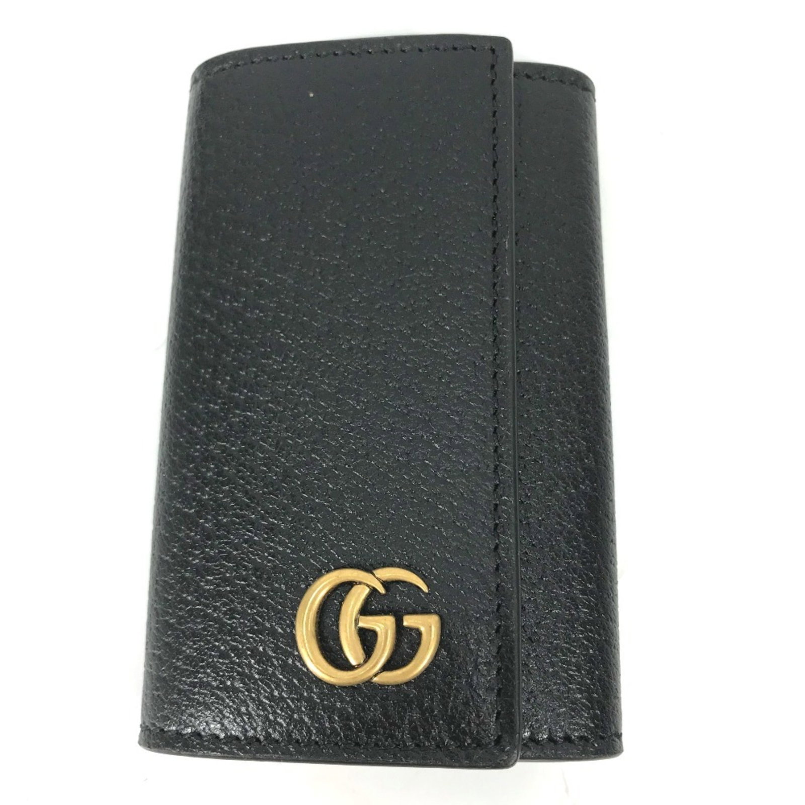Keyring Leather: Keyring Leather Keyring Leather. Made from high-quality leather, this Gucci keyring boasts a sleek black and gold design. Presented in a luxurious box and dust bag, this stylish accessory adds a