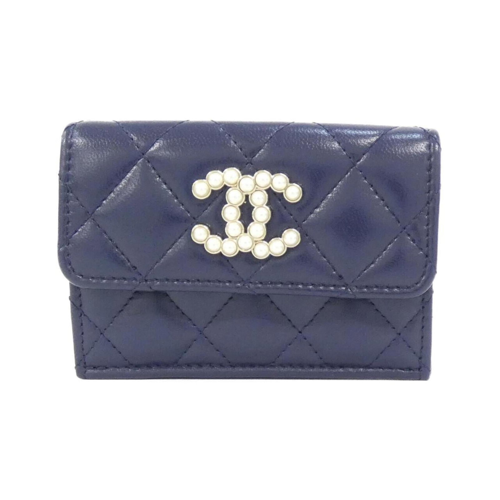 Chanel Wallet (Tri-Fold) Leather: Chanel Wallet (Tri-Fold) Leather Tri-fold leather wallet from iconic French brand Chanel, featuring a classic navy lambskin design. This compact wallet measures 7cm x 10cm x 3cm, making it a stylish