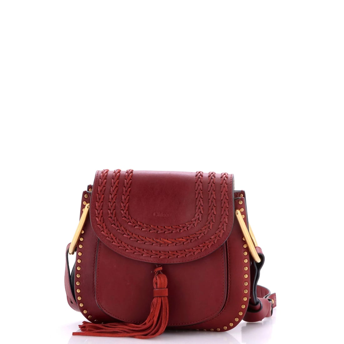 Whipstitch Small Leather Handbag Chloe Hudson: Whipstitch Small Leather Handbag Chloe Hudson Burgundy leather whipstitch details adorn this small Chloe Hudson handbag, measuring 8" tall, 9" wide, and 3" deep. The interior features neutral suede, w