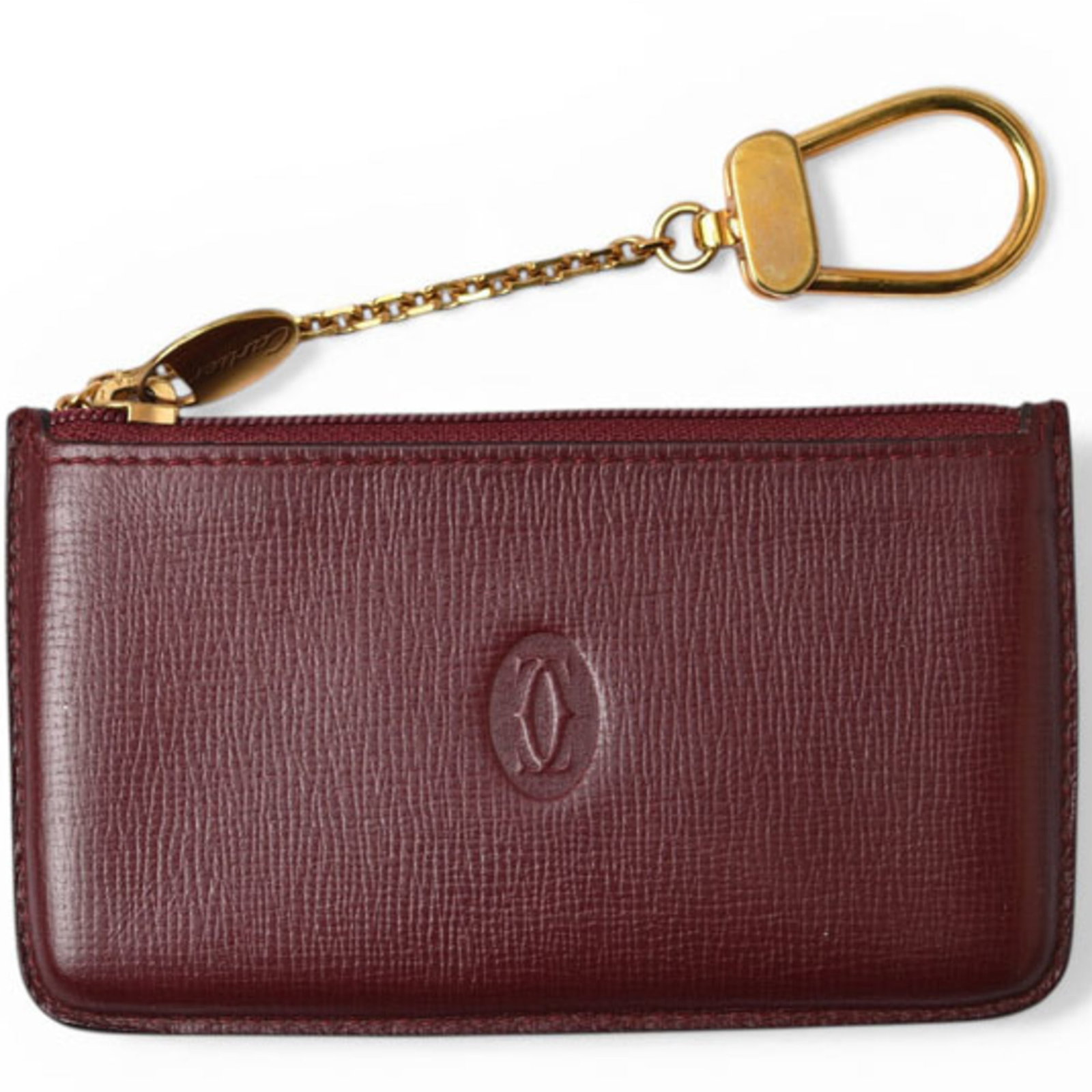 Coin Case Leather Purse Cartier: Coin Case Leather Purse Cartier Cartier's iconic leather coin purse boasts a sophisticated Bordeaux hue, perfectly complemented by a sleek zipper closure. Measuring 6.6cm x 11.5cm x 1cm, this compact 