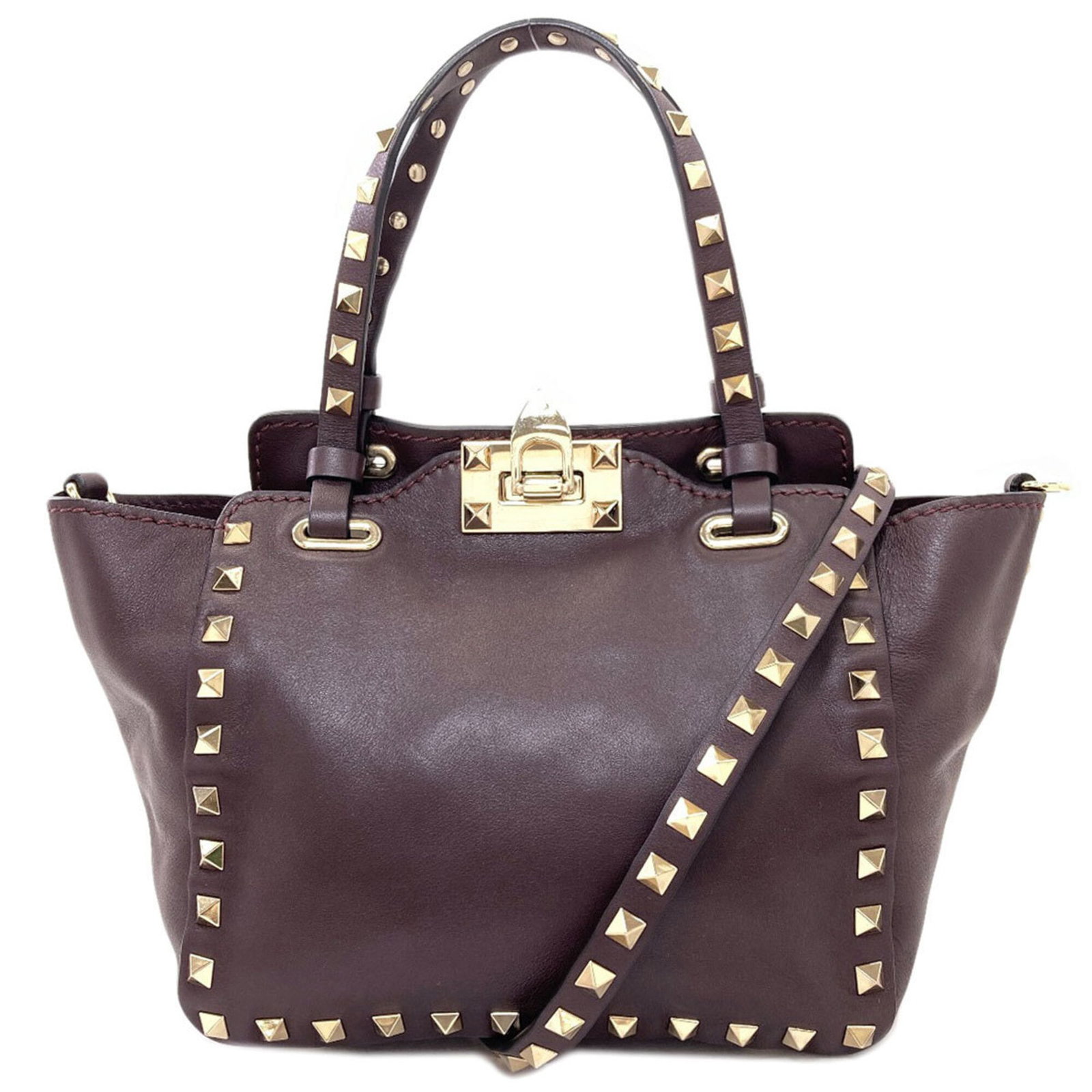 Valentino Handbag Leather: Valentino Handbag Leather Valentino Handbag Leather is a high-quality dark brown calfskin handbag. Made from genuine leather, it features a classic design with a signature. The bag measures 14cm x
