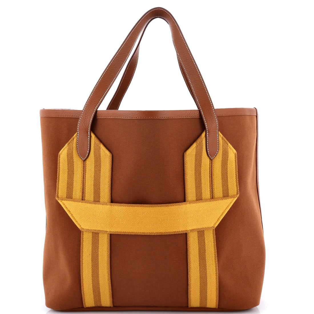 Canvas Hermes Leather Tote Pursangle: Canvas Hermes Leather Tote Pursangle Canvas Hermes Leather Tote Pursangle - A Timeless Brown Classic. This excellent condition Canvas Hermes Leather Tote Pursangle boasts a sturdy brown canvas exterio