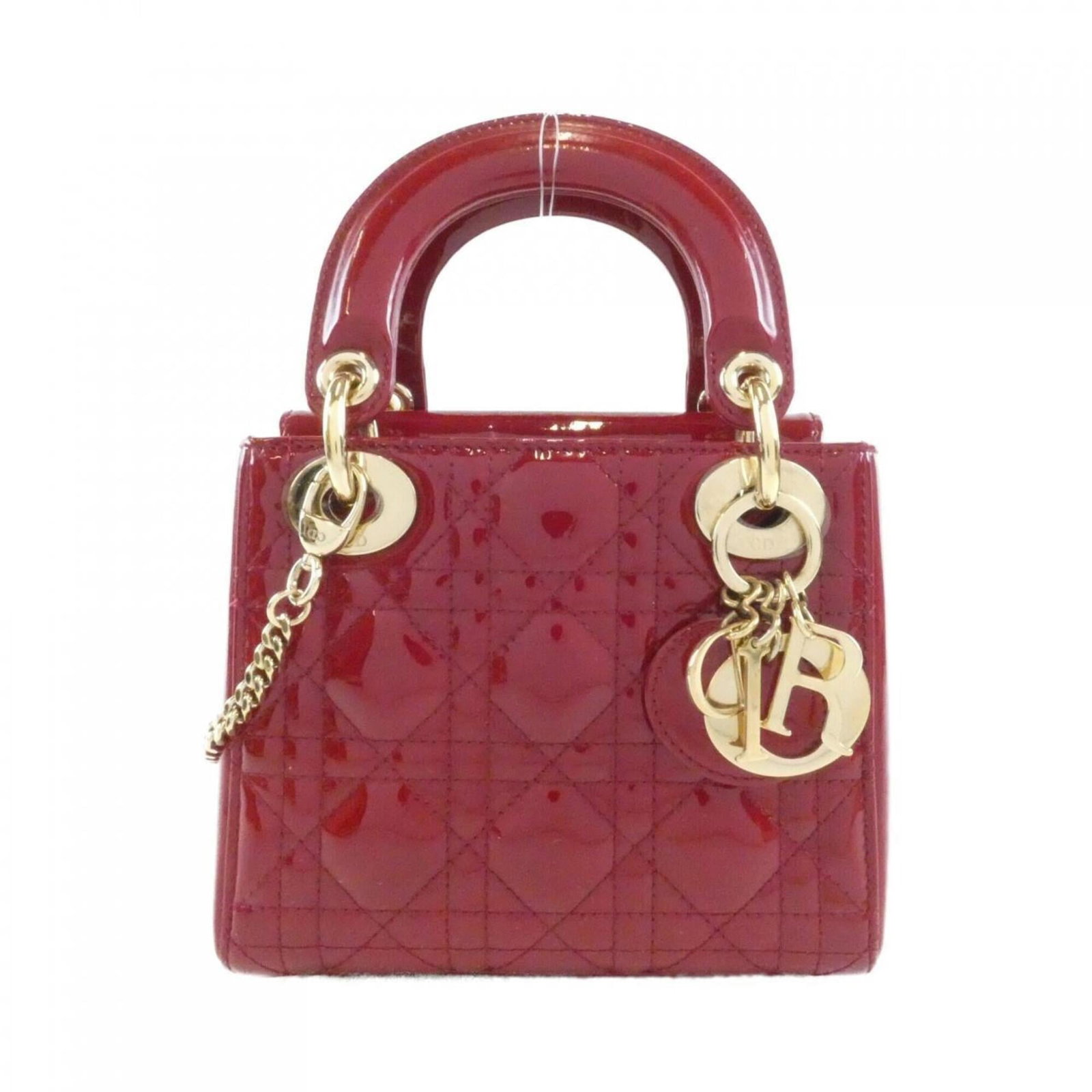 Handbag Leather Dior Christian: Handbag Leather Dior Christian Cherry red leather Dior handbag with a classic design, featuring a signature that bears an enamel finish. This stylish bag measures 14cm x 17cm x 7cm, making it a compac