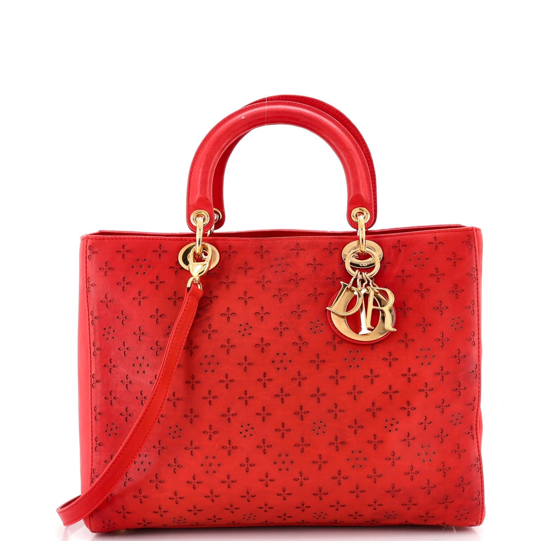 Laser cut leather large Lady Dior Christian Dior Bag: Laser cut leather large Lady Dior Christian Dior Bag Laser cut leather adds a unique touch to this large Lady Dior Christian Dior Cross Body Bag, featuring a bold red exterior and satin black