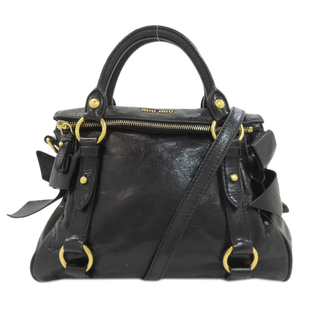 2Way Handbag Calf Miumiu: 2Way Handbag Calf Miumiu Black Calf Miumiu Handbag with 2Way Design. This elegant handbag boasts a sleek black exterior made from high-quality calf material, featuring a distinctive 2Way design that