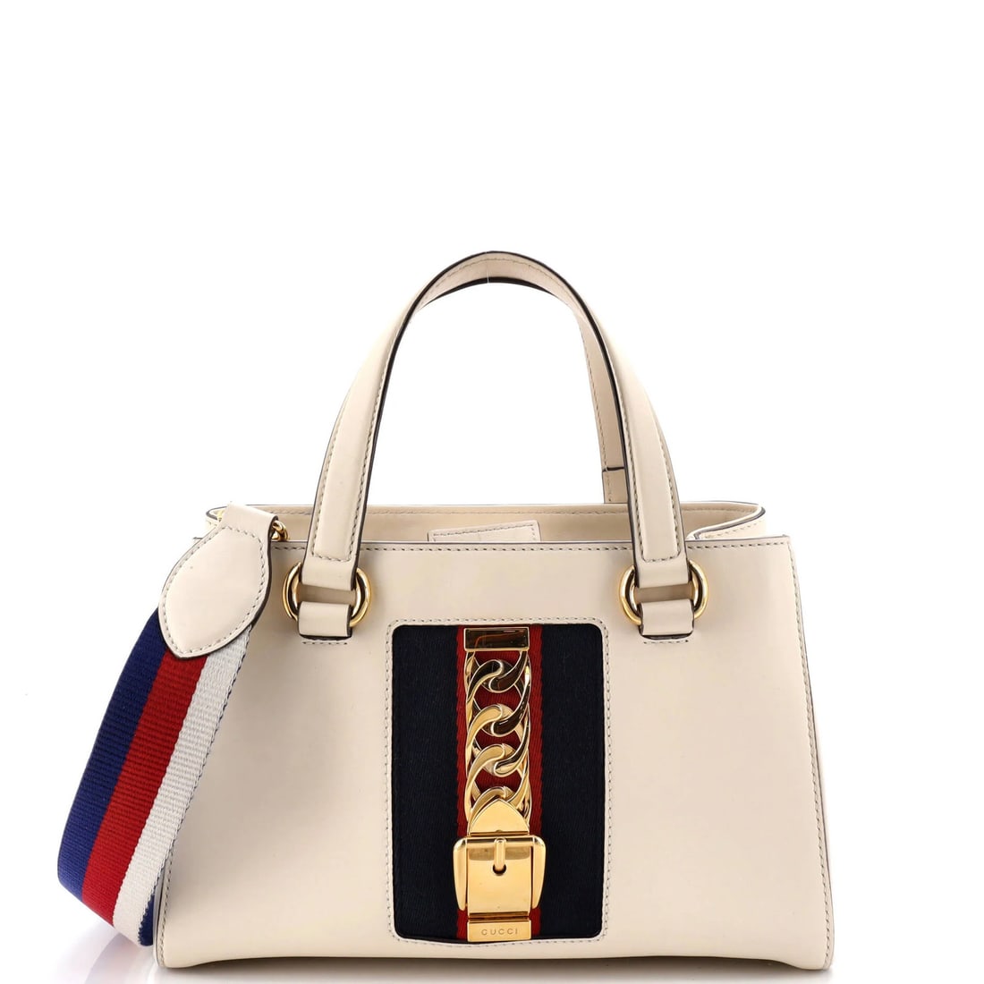 Gucci Sylvie Leather Tote Medium Top Handle: Gucci Sylvie Leather Tote Medium Top Handle White leather medium top handle Gucci Sylvie tote with gold hardware, featuring microfiber interior and a classic design. The exterior shows signs of wear,