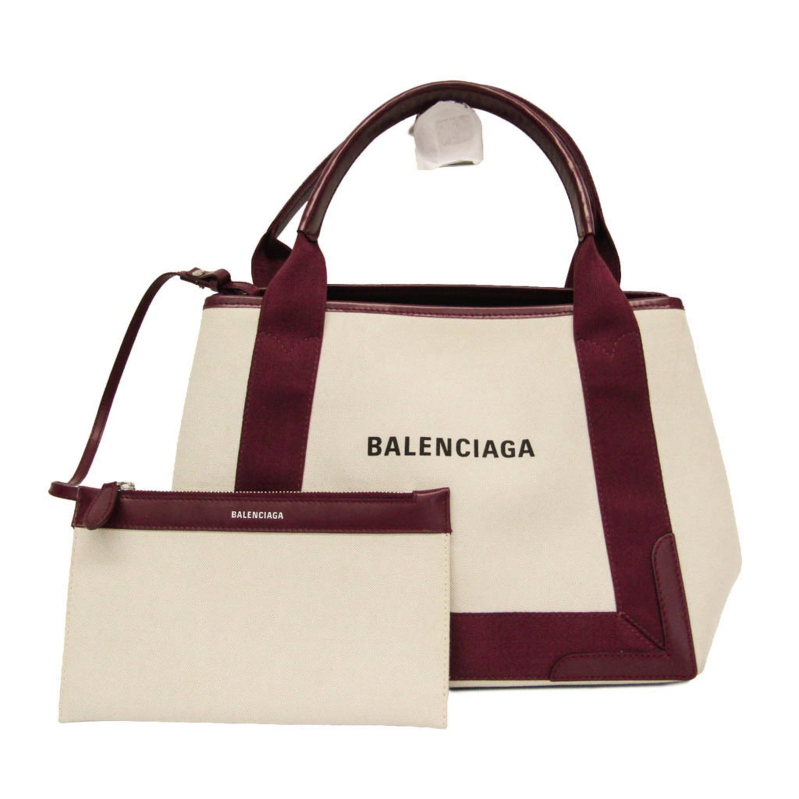 Canvas leather handbag by Balenciaga: Canvas leather handbag by Balenciaga Canvas leather handbag by Balenciaga, featuring a Bordeaux and off-white color combination, open closure, and a spacious pouch with an inner pocket. The bag