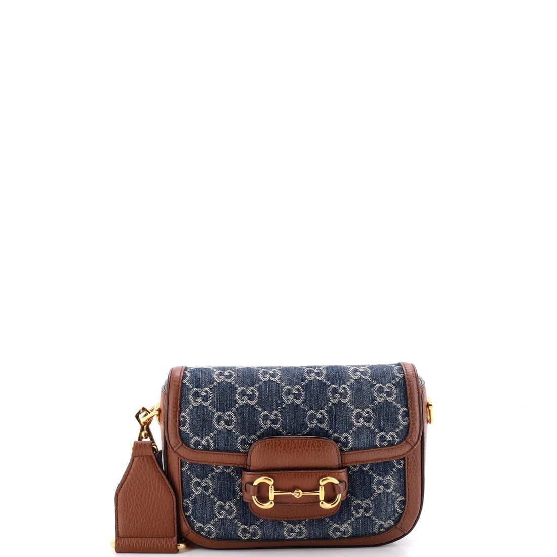 Gucci 1955 Horsebit Bag Denim Mini GG: Gucci 1955 Horsebit Bag Denim Mini GG Denim mini Horsebit 1955 GG shoulder bag from Gucci, featuring a classic design with a blue exterior and neutral interior. This mini bag boasts a signature Horseb