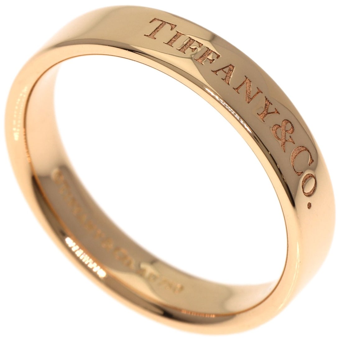Flat Band Ring K18 Pink Gold Tiffany: Flat Band Ring K18 Pink Gold Tiffany K18 Pink Gold Tiffany ring features a flat band design, showcasing the luxurious feel of 18k gold metal. This piece is a genuine Tiffany&Co. creation, bearing the 
