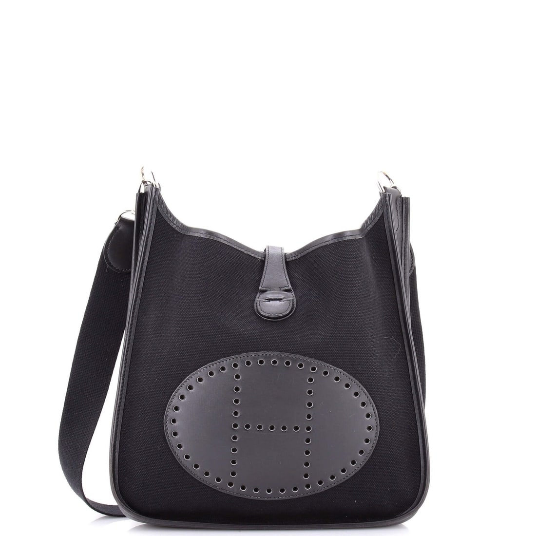 Hermes Evelyne Leather Bag Toile Gen I: Hermes Evelyne Leather Bag Toile Gen I The Hermes Evelyne Leather Bag Toile Gen I is a timeless, black canvas and leather cross body bag with a classic design. Measuring 11" tall, 11.5" wide, and 3"