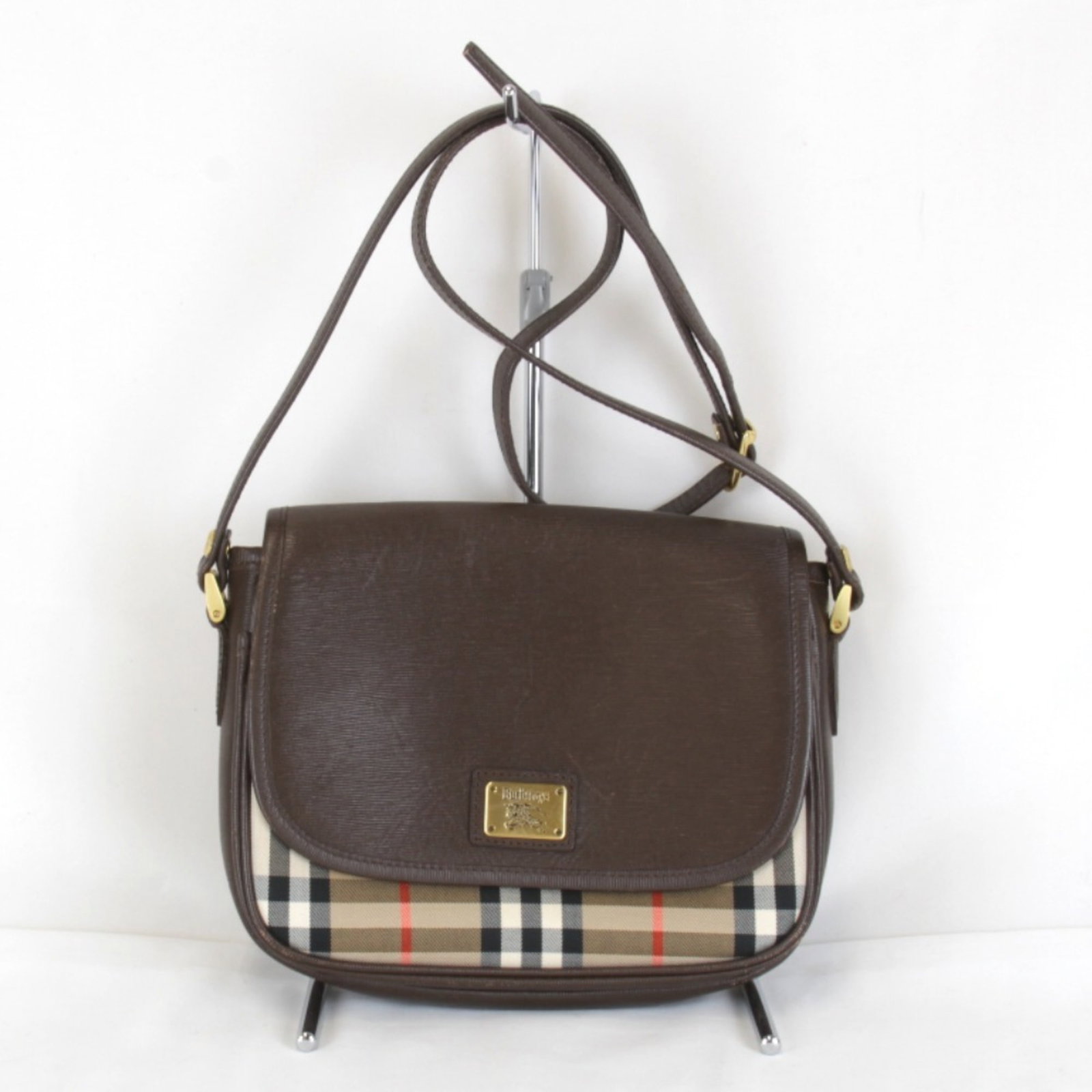 Shoulder Bag Burberry Canvas Leather: Shoulder Bag Burberry Canvas Leather Brown leather and canvas shoulder bag from Burberry, measuring 18cm x 22cm x 5cm. This classic design combines a sturdy canvas base with high-quality leather
