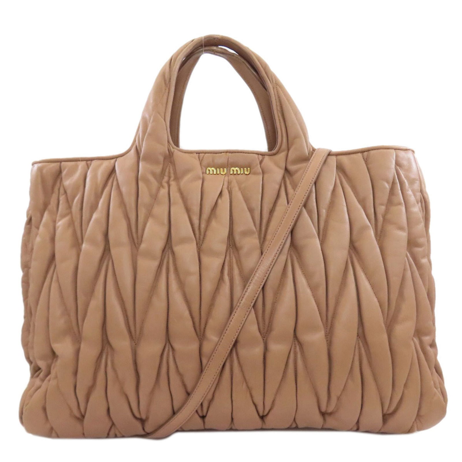 Handbag Miu Leather: Handbag Miu Leather Handbag made from high-quality lambskin leather, measuring 32cm x 48cm x 14cm. The brown color and classic design make it a stylish and timeless accessory. Made by the Italian