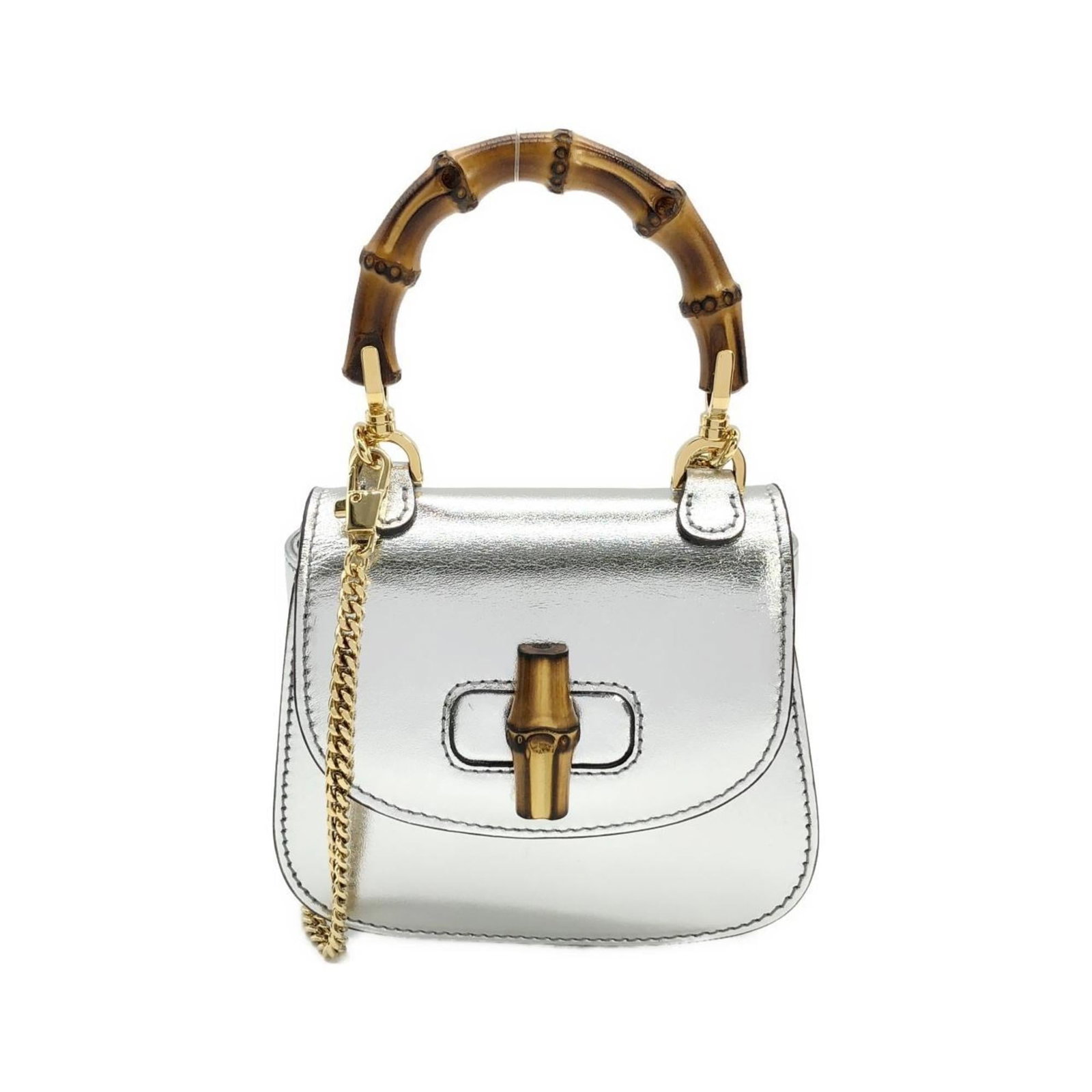 Handbag Leather Gucci: Handbag Leather Gucci This is a genuine Gucci handbag made from high-quality leather, featuring a sleek silver finish and gold hardware. The compact design measures 10cm x 10cm x 4cm, making it a