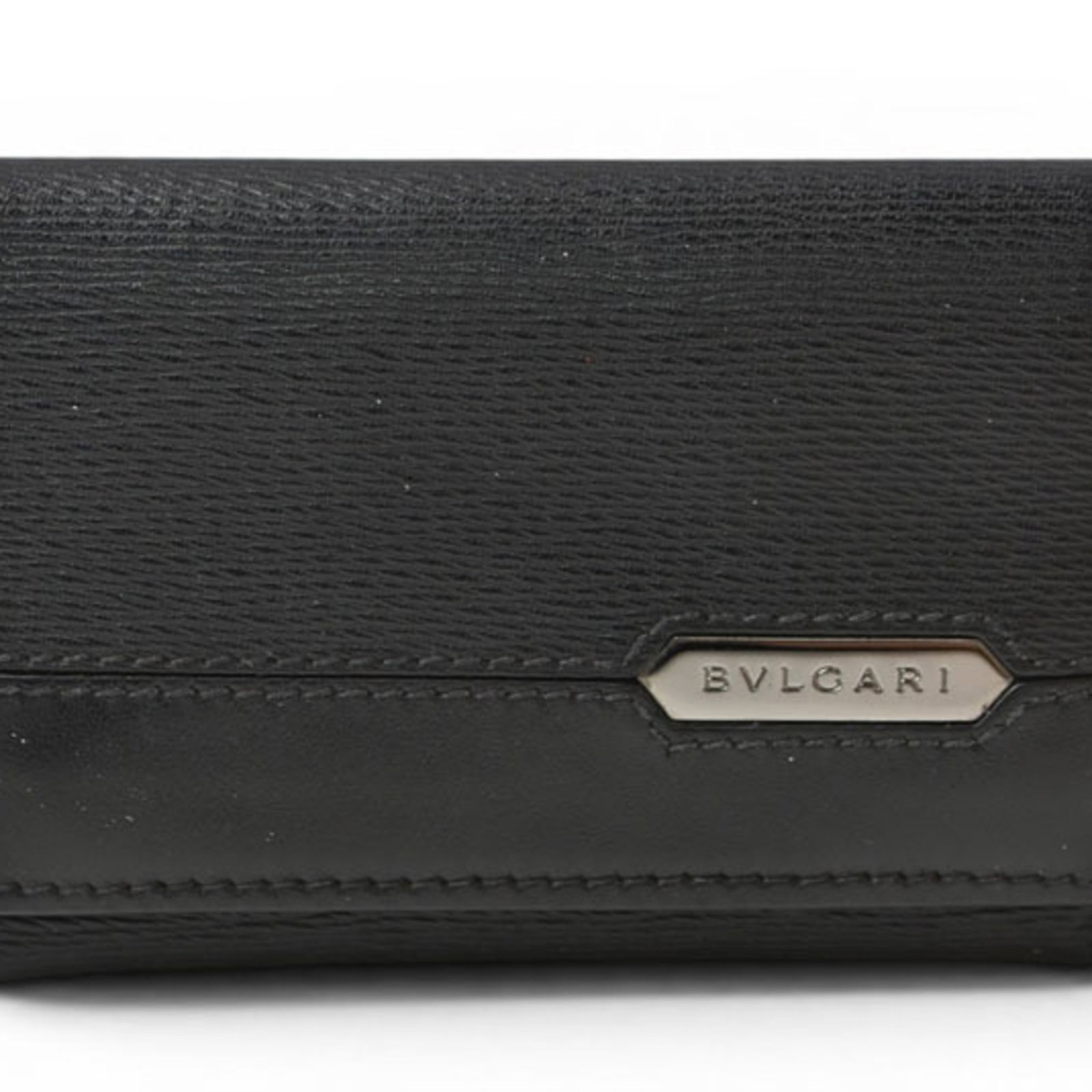 Bvlgari Coin Purse/ Coin Case Leather: Bvlgari Coin Purse/ Coin Case Leather The Bvlgari Coin Purse is a sleek and sophisticated leather accessory, crafted from high-quality black leather. Measuring 6.7cm x 10.2cm x 1.5cm, it features a