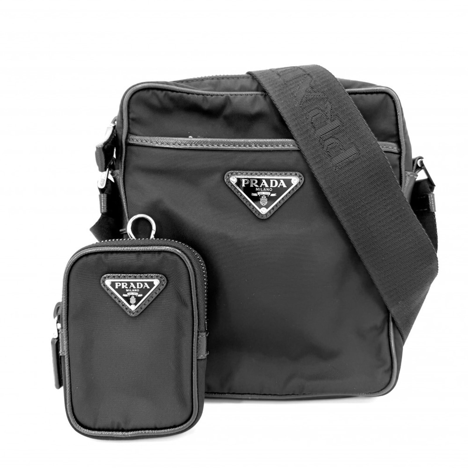 Shoulder Bag Nylon: Shoulder Bag Nylon The Prada Shoulder Bag Nylon is a sleek and modern accessory, made from durable nylon material and featuring a classic black color. Measuring 20cm x 17.5cm x 5.5cm, it has a