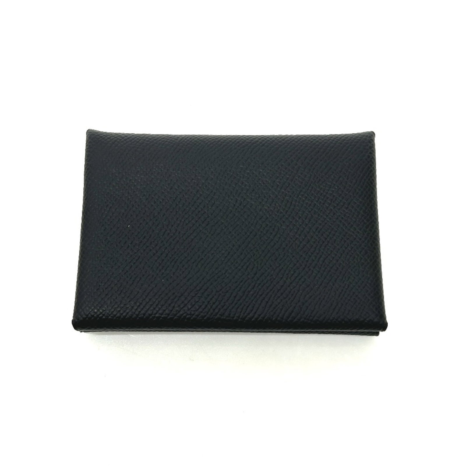 Hermes Coin Purse/ Coin Case Epsom Leather: Hermes Coin Purse/ Coin Case Epsom Leather Epsom leather craftsmanship shines in this sleek black coin purse from Hermes, measuring 7.5cm x 10.3cm x 2cm. The subtle design and precise stitching