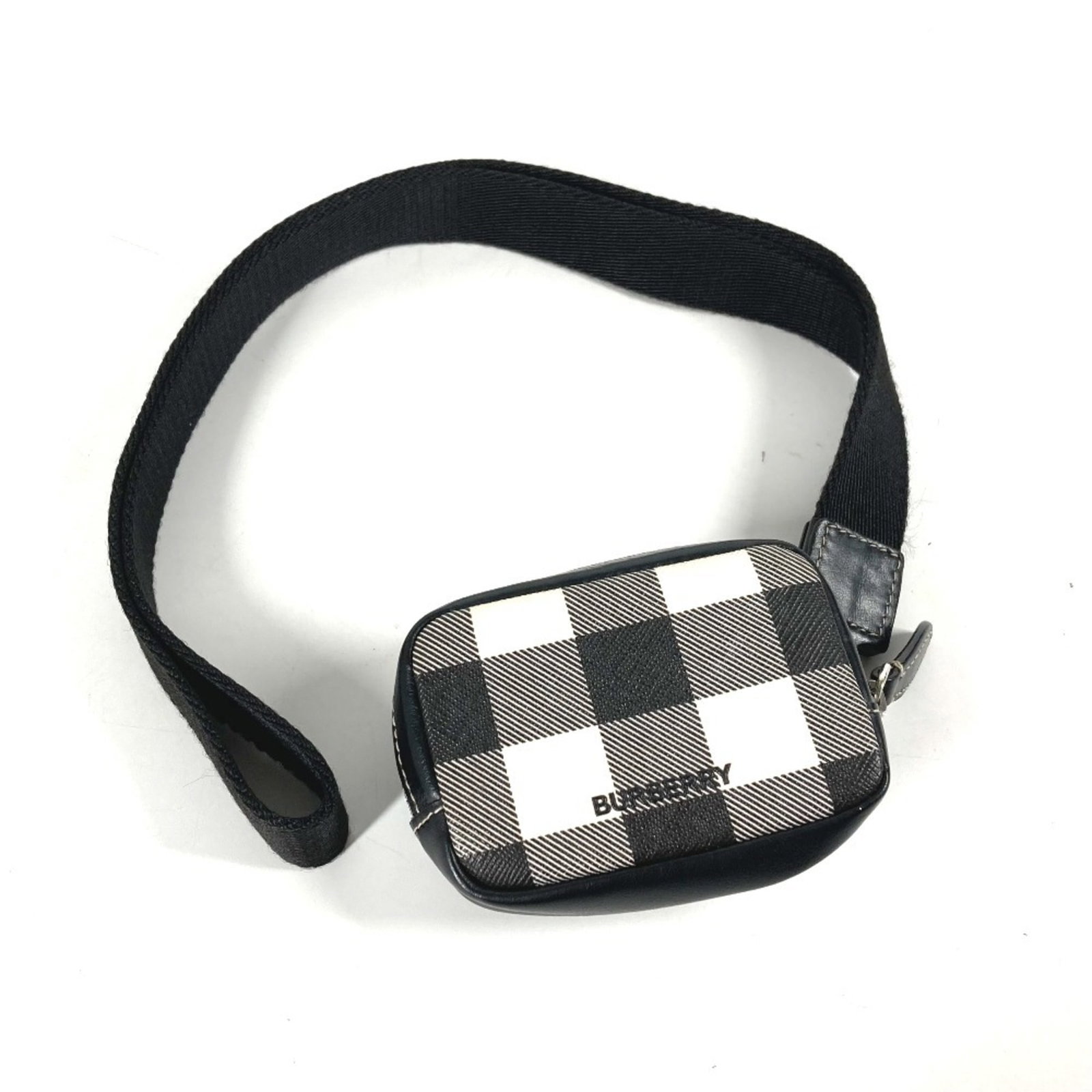 Purse Coin Case Leather Pvc Burberry: Purse Coin Case Leather Pvc Burberry Black and White Burberry Coin Case is made from PVC and leather, with a size of 6cm x 9cm. The purse features a simple design with no additional accessories. It