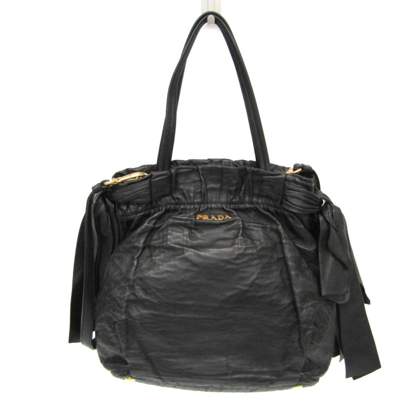 Nappa Leather Handbag Prada Shoulder Bag: Nappa Leather Handbag Prada Shoulder Bag Prada's iconic Side Bow design is showcased in this sleek Nappa leather shoulder bag, featuring a timeless black color and adjustable strap for a customizable
