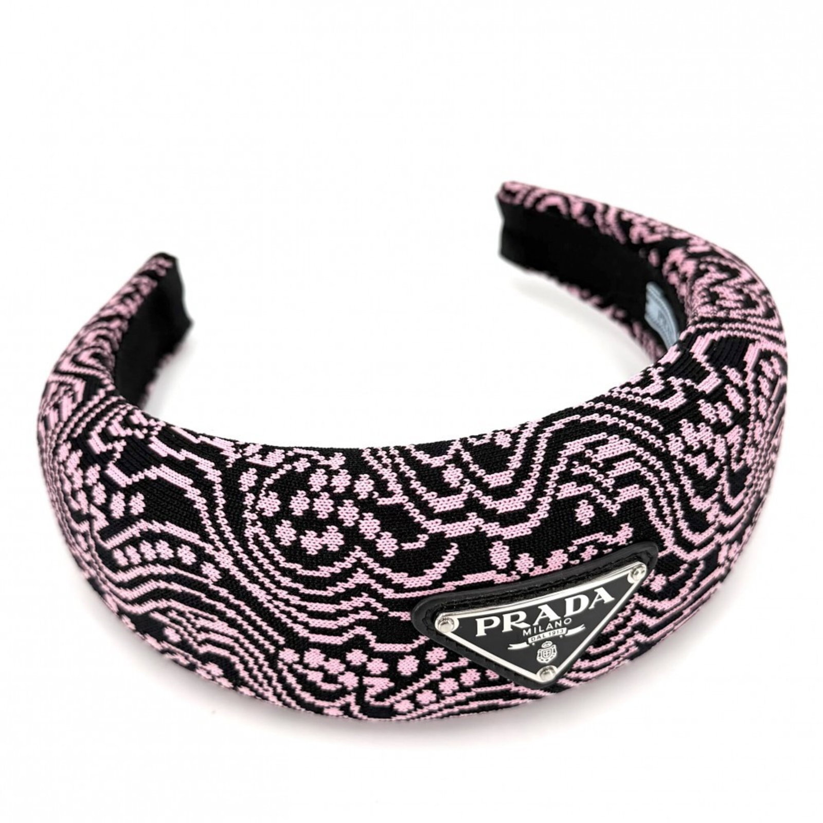 Alice Band Canvas by Prada: Alice Band Canvas by Prada Black or pink canvas Alice band by Prada, measuring 16cm x 17cm. This canvas band features a signature, adding a touch of elegance to any outfit. Item Specifics: Brand: Prad