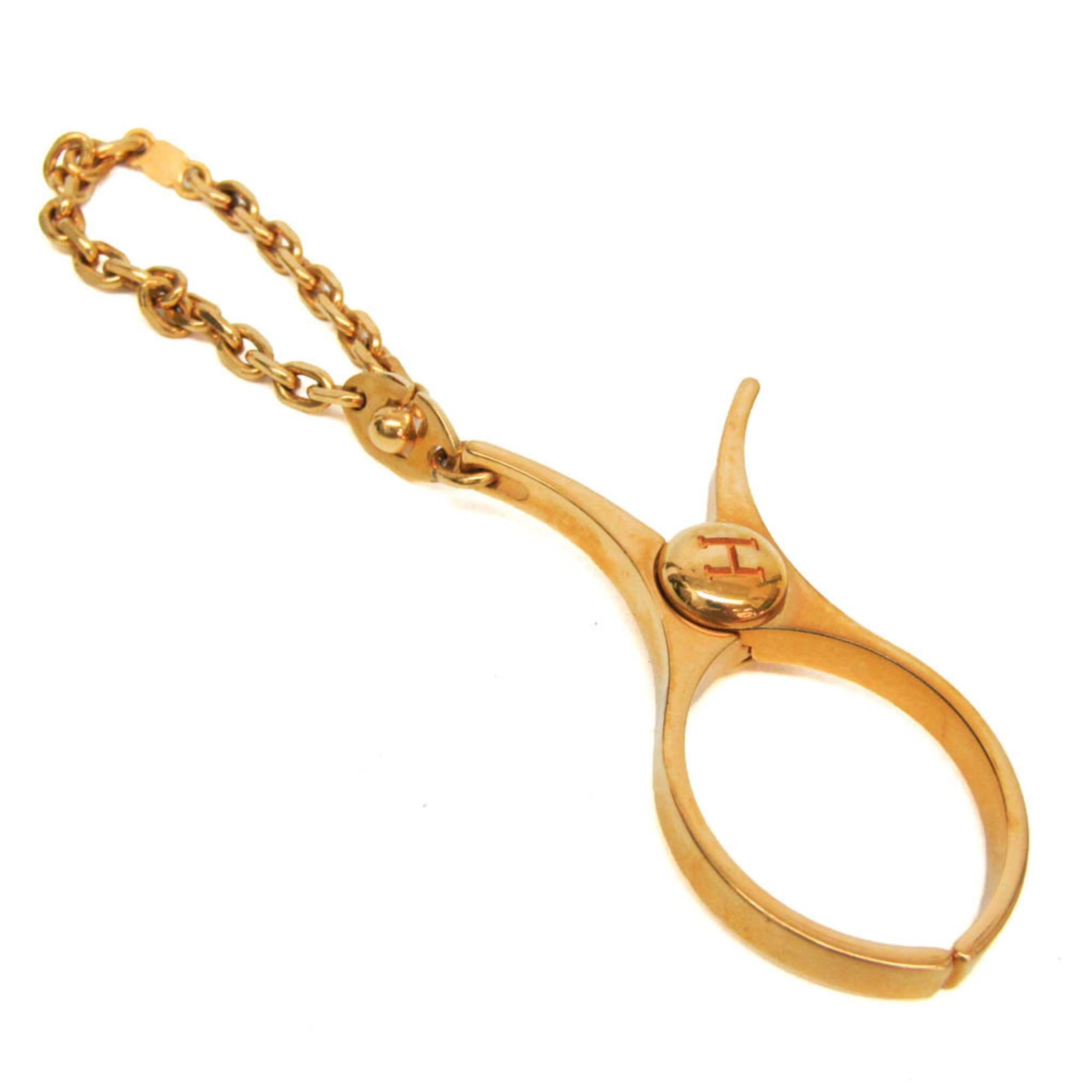 Glove Holder Metal by Hermes: Glove Holder Metal by Hermes Gold Glove Holder by Hermes features a sleek metal design with a compact size, measuring 12.5cm x 2.8cm. The holder's gold color adds a touch of luxury, while its