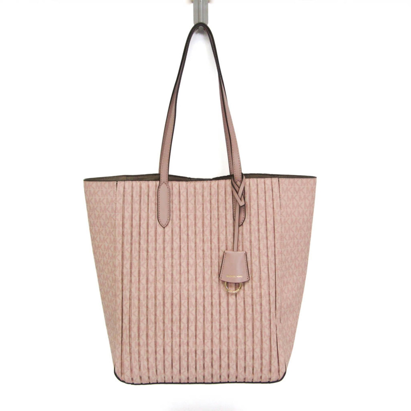PVC Tote Bag Kors Michael: PVC Tote Bag Kors Michael The Michael Kors Sinclair Pleated Shopper Tote is a stylish large tote bag made from PVC material, featuring a pink color and a magnetic snap closure. This practical bag has
