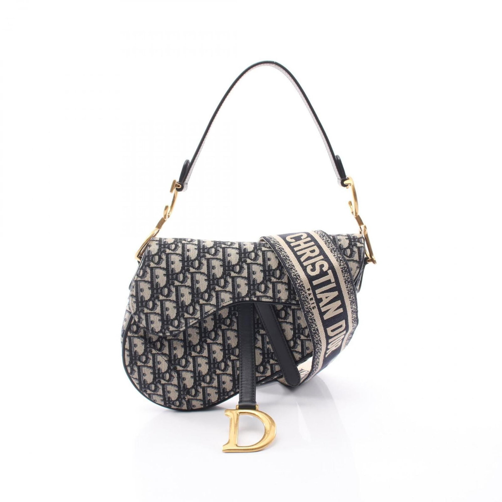 Christian Dior Leather Canvas Saddle Bag: Christian Dior Leather Canvas Saddle Bag Canvas and leather come together in this understated Christian Dior Saddle Bag, with a beige and navy color combination that adds a touch of sophistication.