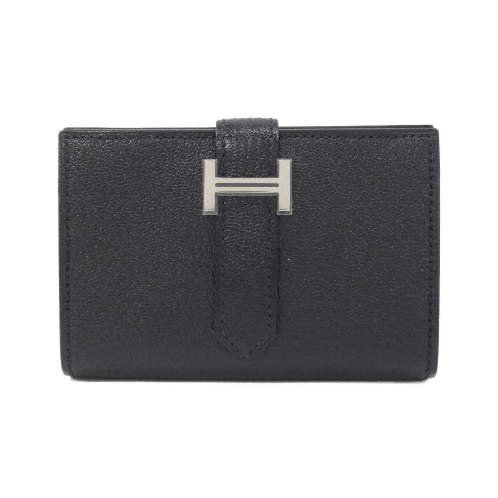 Chevre Leather Bi Fold Wallet Hermes: Chevre Leather Bi Fold Wallet Hermes Chevre leather bi-fold wallet from Hermes, crafted with attention to detail and a classic design. This sleek and sophisticated accessory features a sturdy black