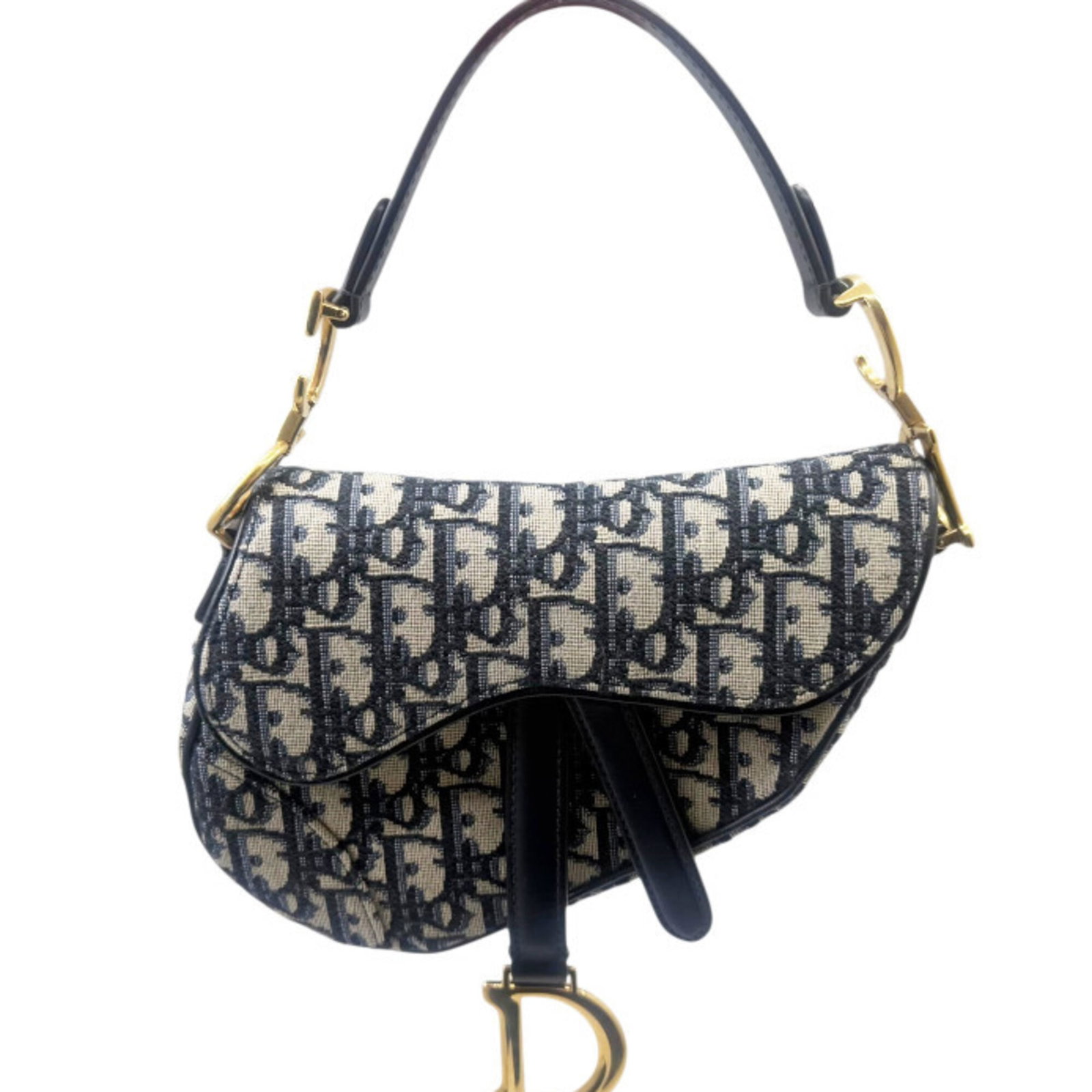 Christian Dior Leather Canvas Saddle Bag: Christian Dior Leather Canvas Saddle Bag Canvas and leather come together in this Christian Dior Saddle Bag, featuring a navy color and compact size of 15cm x 18cm x 4cm. The bag's canvas material and