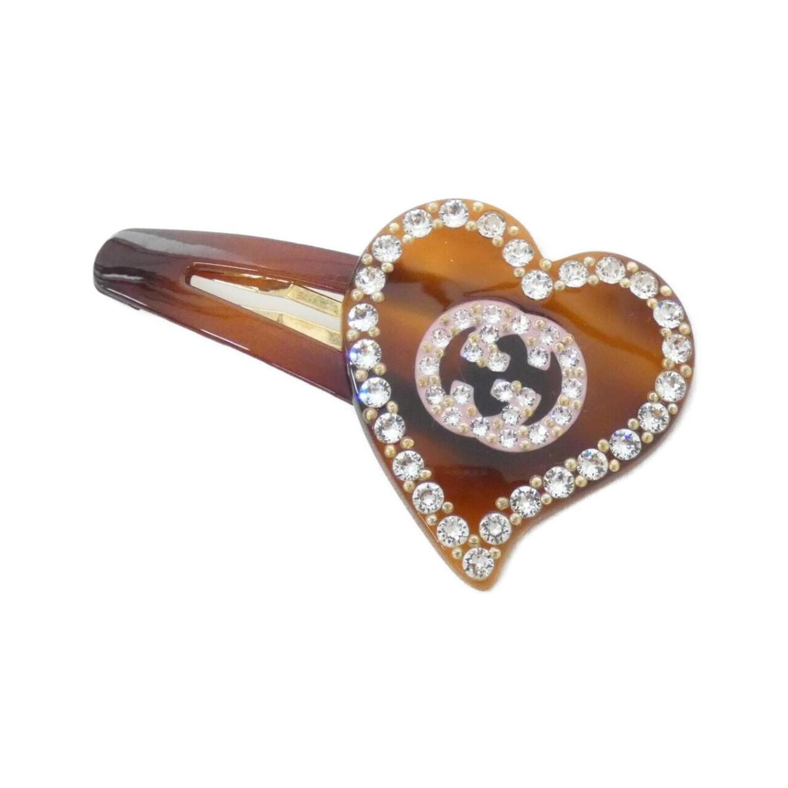 Clip Hair Gucci: Clip Hair Gucci Clip Hair Gucci is a stylish hair accessory featuring a signature from the brand. Made from high-quality materials, this hair clip is a compact and elegant accessory that can add a tou