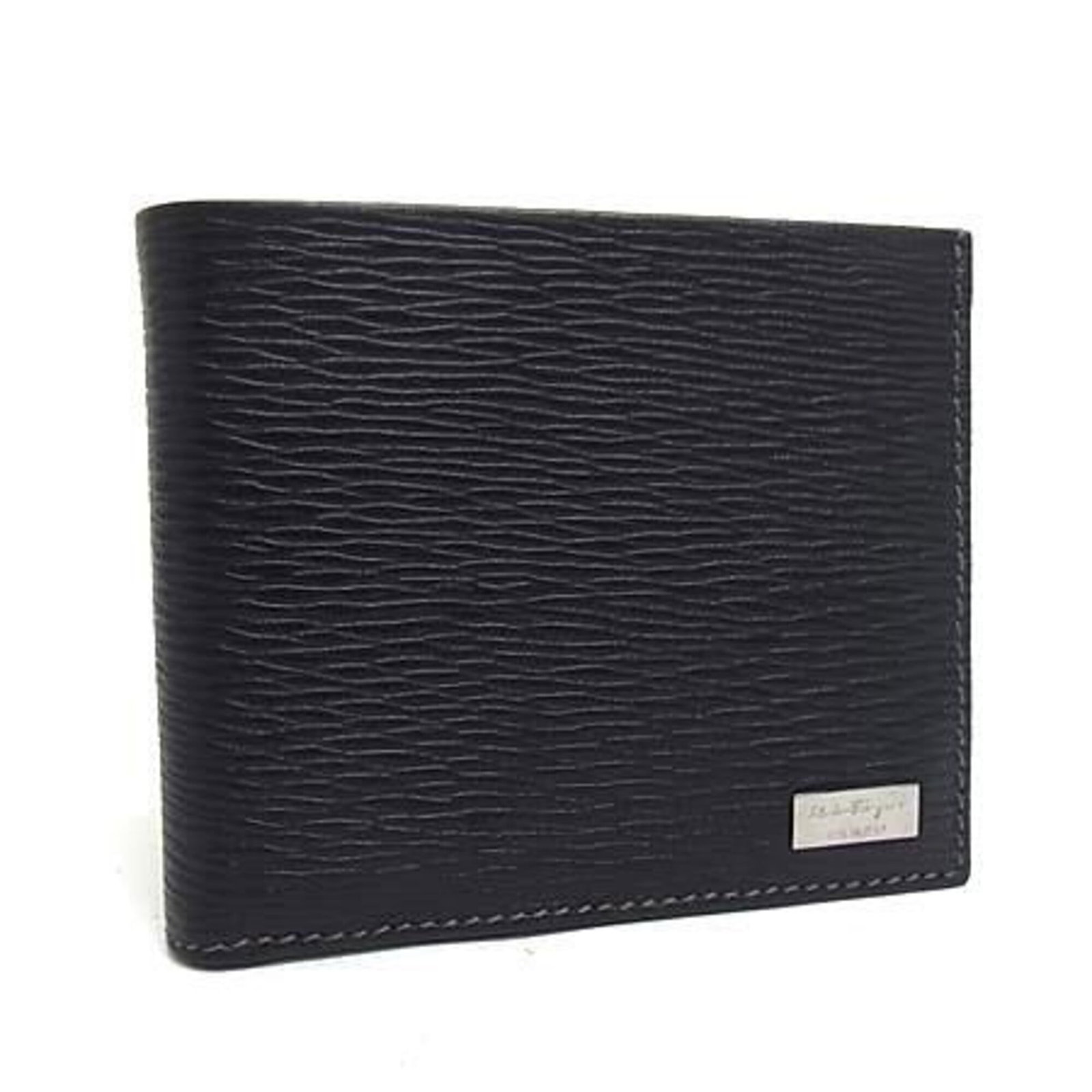 Salvatore Ferragamo Leather Wallet Bi-Fold: Salvatore Ferragamo Leather Wallet Bi-Fold Salvatore Ferragamo Leather Wallet Bi-Fold is a high-quality, Italian-made bi-fold wallet crafted from genuine leather. Featuring a sleek black design, this