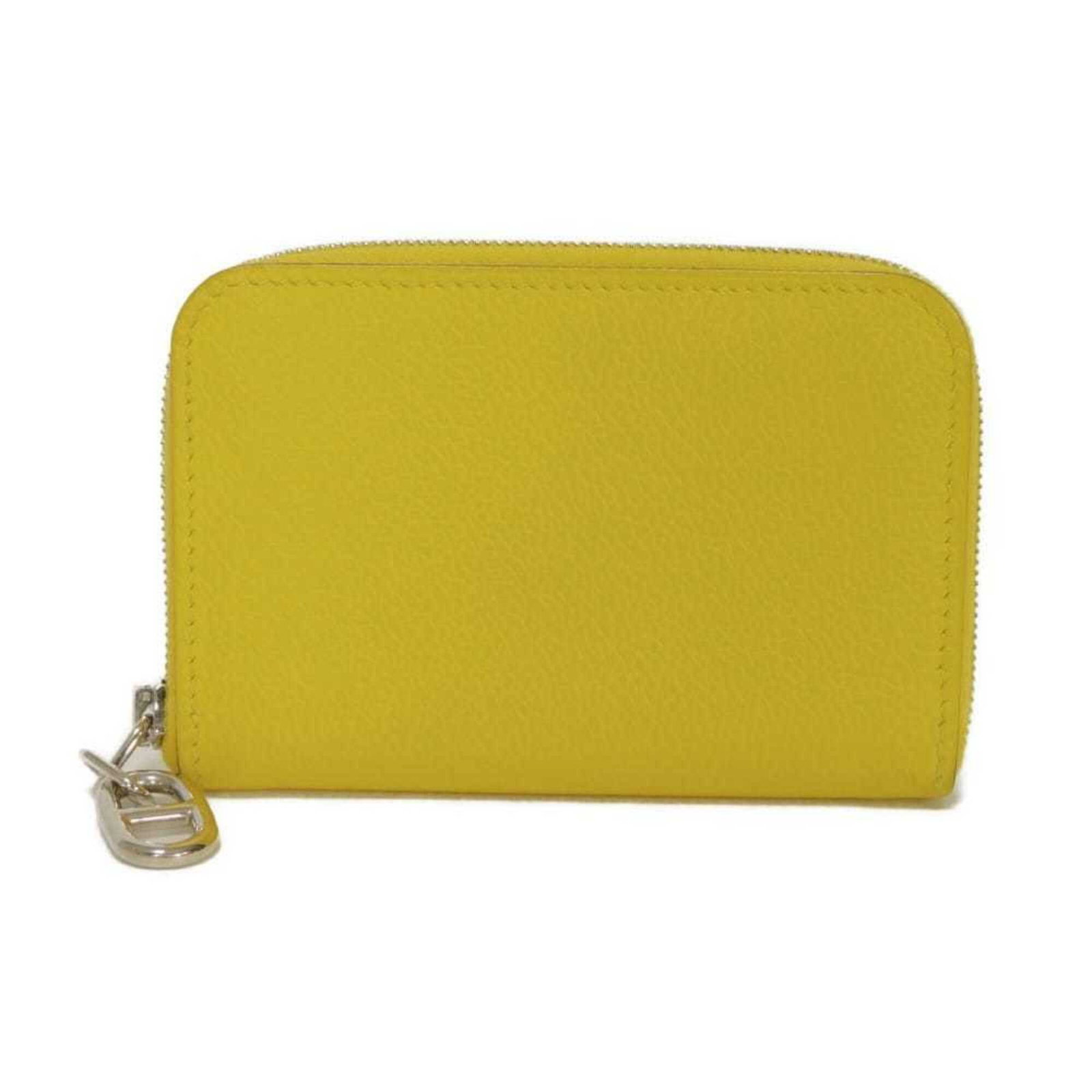 Hermes Coin Evercalf Leather Purse: Hermes Coin Evercalf Leather Purse Evercalf leather provides a durable and long-lasting finish for this yellow coin purse, measuring 7.5cm x 11cm x 1.3cm in size. The iconic Coin purse/coin case
