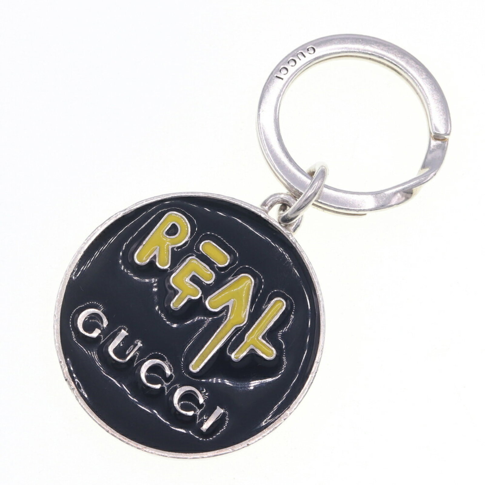 Silver Keyring Sterling Enamel Gucci: Silver Keyring Sterling Enamel Gucci Silver Keyring Sterling Enamel Gucci bears a signature and is made from 925 sterling silver with enamel details. The item measures 4cm x 4cm and features a black