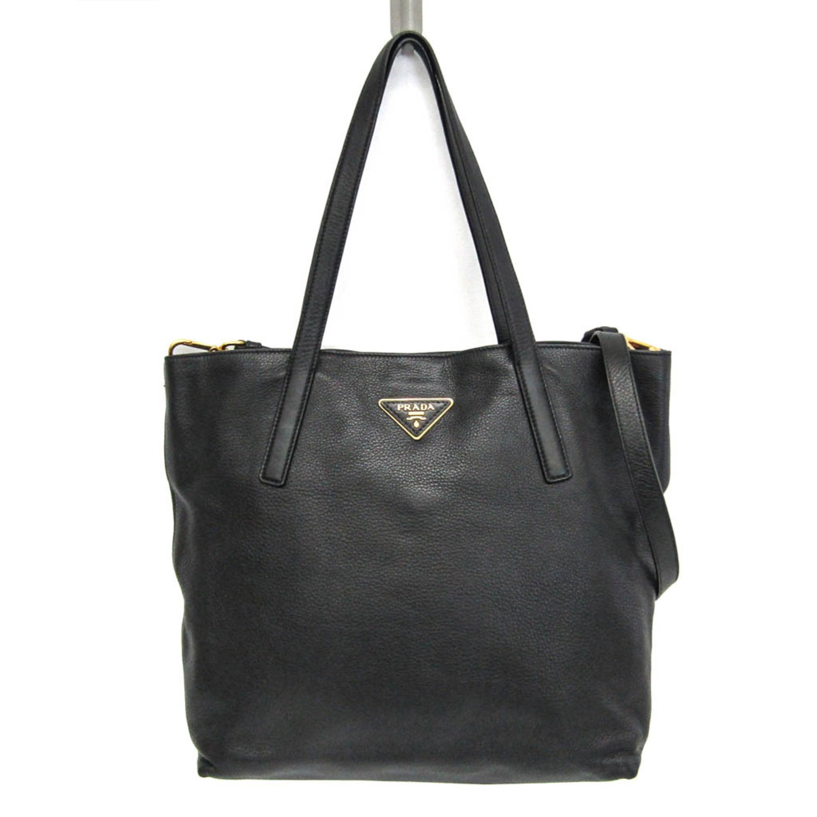 Shoulder Bag Leather Tote: Shoulder Bag Leather Tote The Prada Triangle logo shoulder bag tote is a sleek and sophisticated leather tote, made from high-quality black leather. Measuring 34cm x 42cm x 14cm, it features a