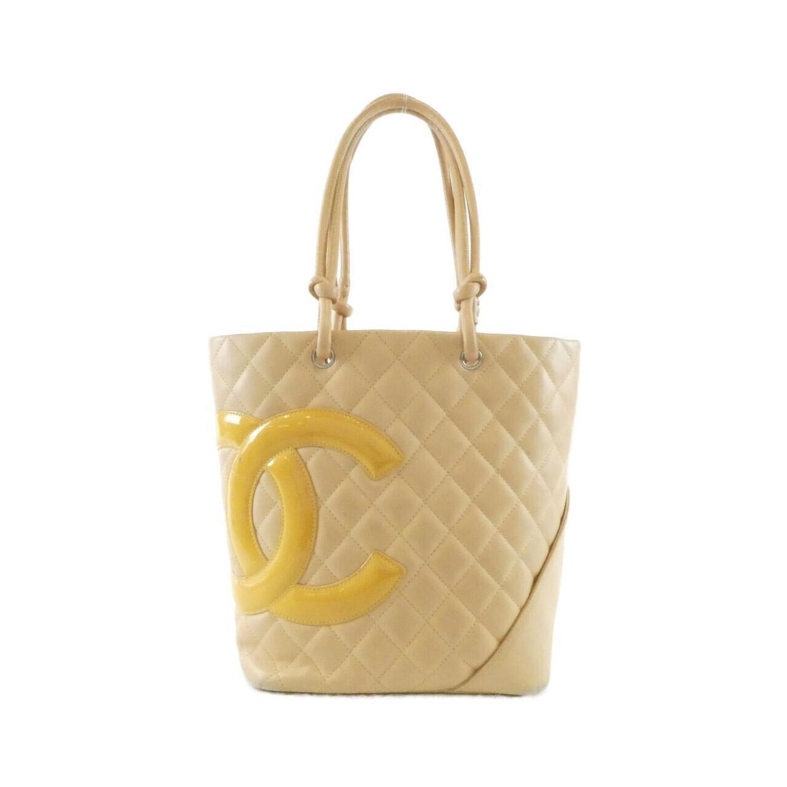 Handbag Leather from Chanel: Handbag Leather from Chanel Calfskin and enamel leather construction gives this Chanel handbag its unique look and feel. The beige color and classic design make it a timeless piece that can be easily