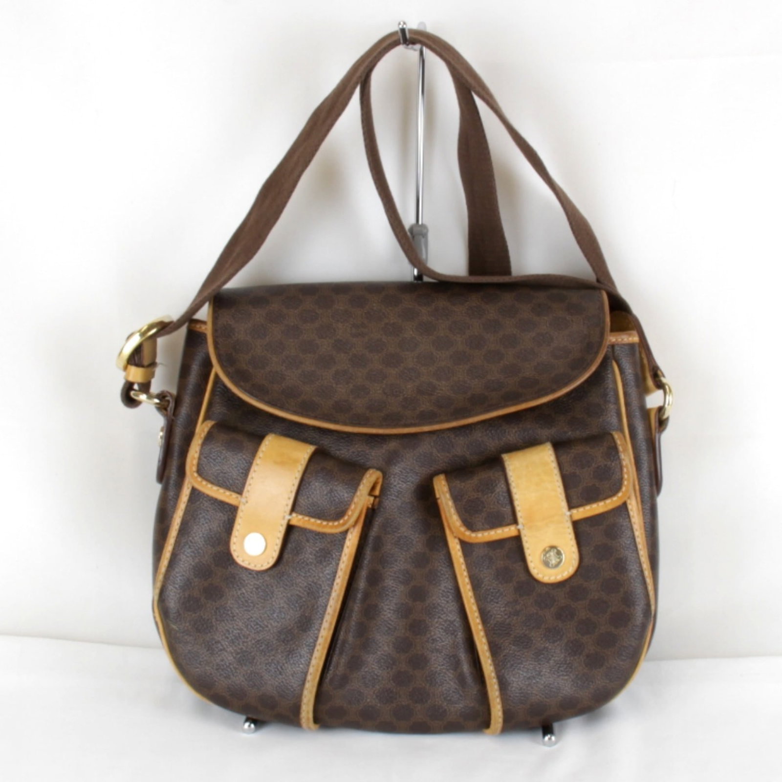 Pvc Leather Celine Shoulder Bag: Pvc Leather Celine Shoulder Bag PVC Leather Celine Shoulder Bag. Made from a combination of PVC and leather, this shoulder bag features a classic design with a brown color. With its compact size and