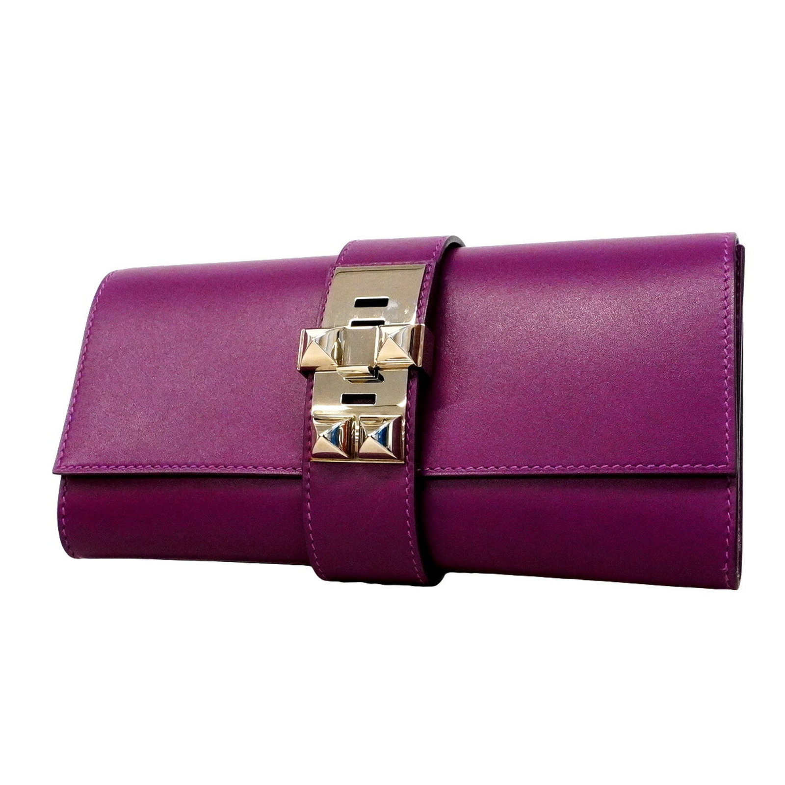 Tadelakt Leather Hermes Bag Clutch: Tadelakt Leather Hermes Bag Clutch Tadelakt leather adds a unique texture to this elegant clutch bag from Hermes. The violet color and silver hardware create a sophisticated look, while the compact