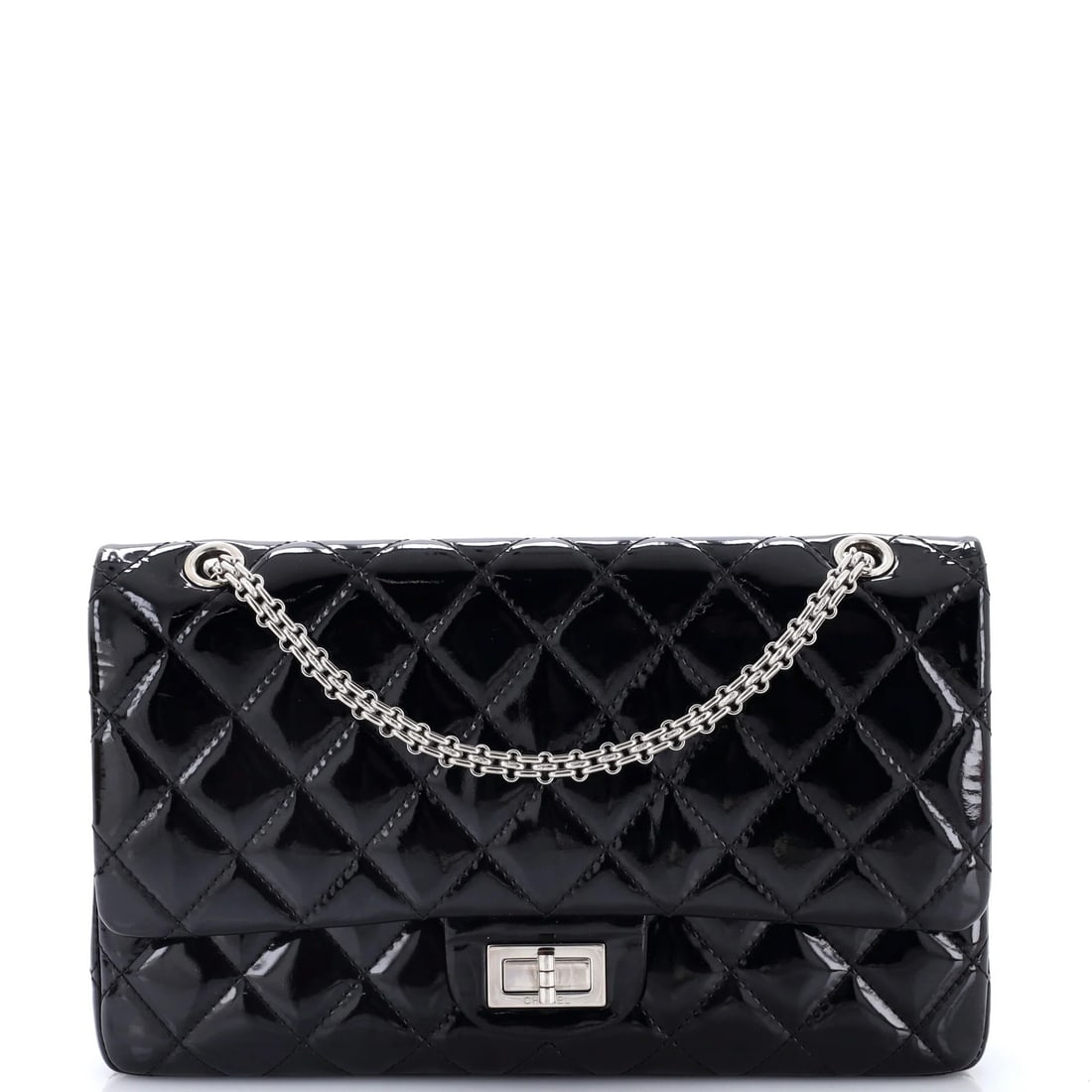 Quilted Patent Bag 227 Chanel 2.55 Reissue: Quilted Patent Bag 227 Chanel 2.55 Reissue The Quilted Patent Bag 227 Chanel 2.55 Reissue boasts a sleek black patent leather exterior, adorned with the iconic quilted design, and features a spacious