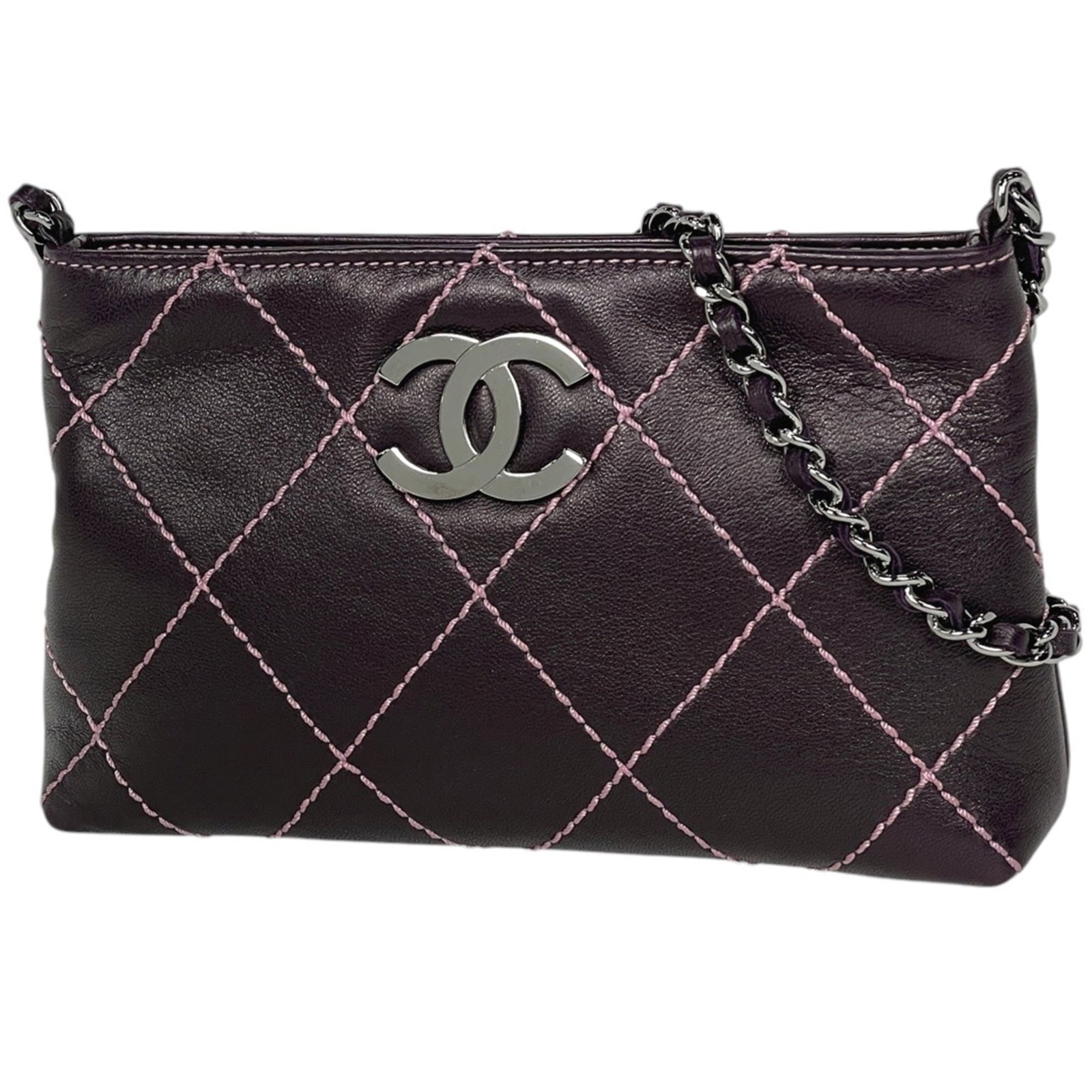 Leather Pouch by Chanel: Leather Pouch by Chanel Purple leather pouch with a rich, luxurious feel, measuring 11cm x 18cm x 4cm. This stylish accessory bears a signature, adding a touch of sophistication to any outfit. Item