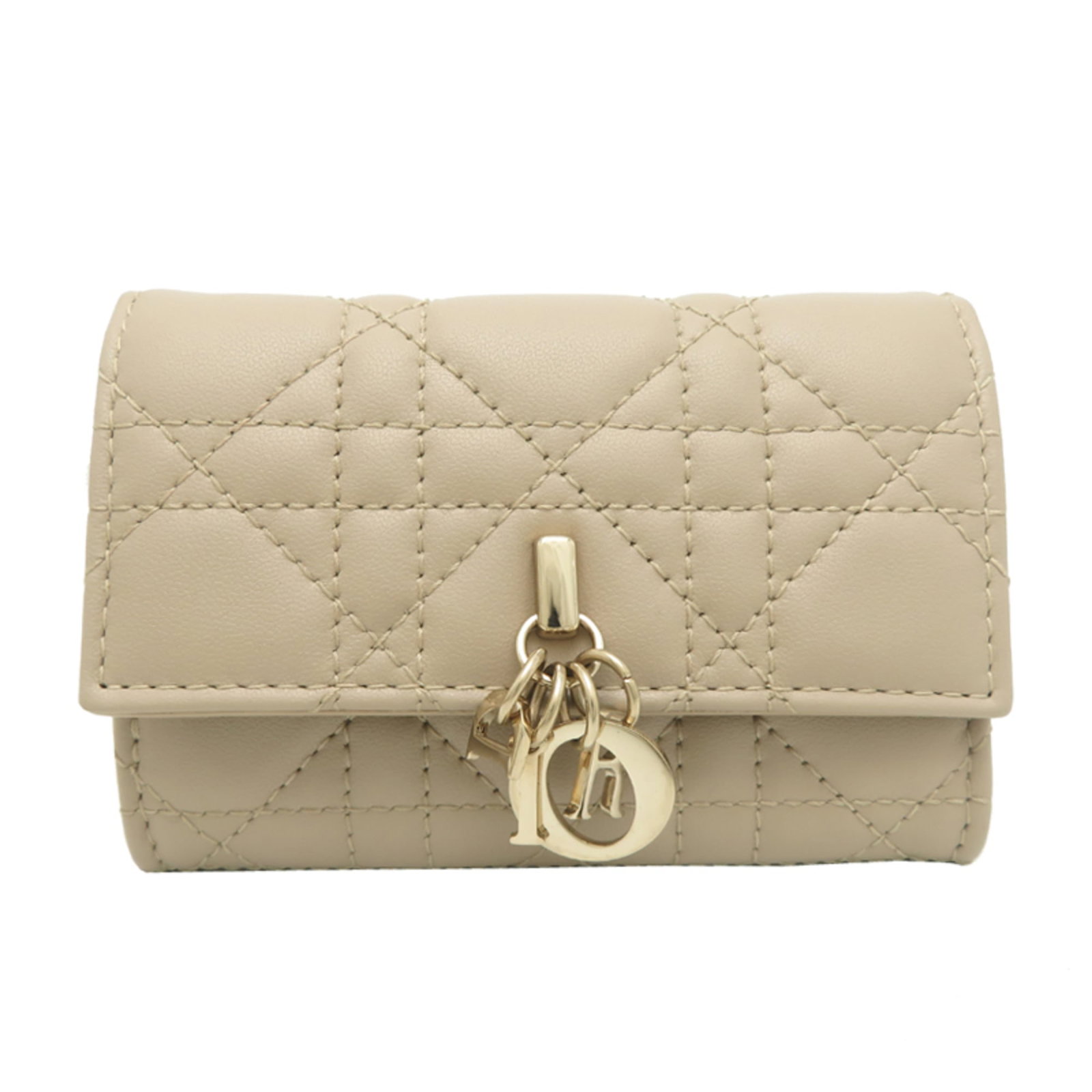 Dior Christian Coin Leather Purse: Dior Christian Coin Leather Purse Christian Dior's Coin Leather Purse is a stylish and elegant accessory, crafted from high-quality lamb leather in a soft beige color. This compact coin purse