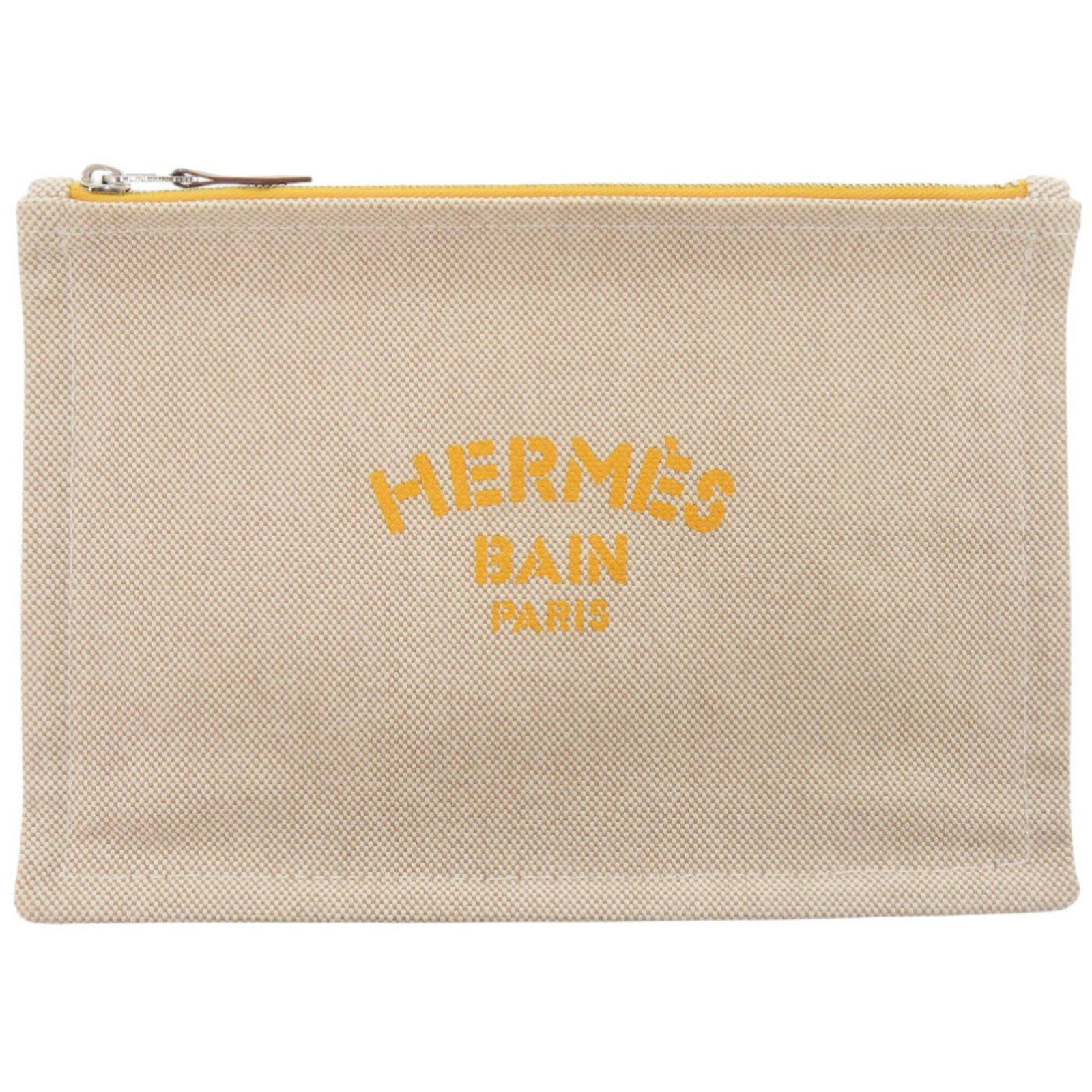 Cotton Pouch Hermes: Cotton Pouch Hermes Cotton Pouch from Hermes, made in France, features a classic design with a beige color and a compact size of 15.5cm x 22cm. This pouch is made from cotton material and bears a sign