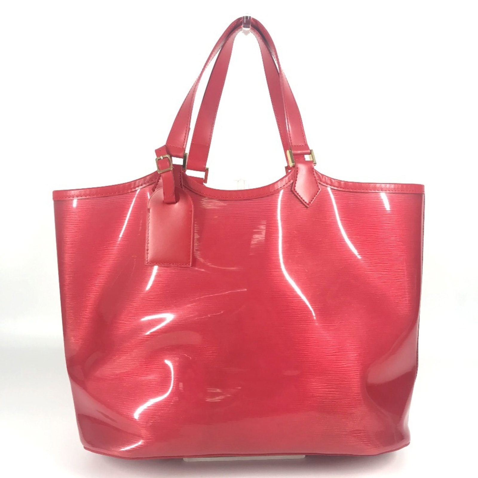 Vinyl Leather Handbag Louis Vuitton Tote: Vinyl Leather Handbag Louis Vuitton Tote Vinyl Leather Handbag Louis Vuitton Tote in Red Color. This Louis Vuitton tote bag features a unique combination of vinyl and leather materials, showcasing a